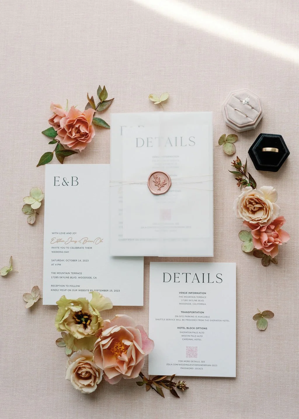 Elegant Mountain Terrace wedding invitation flatlay with florals and wax seal in Woodside, California.