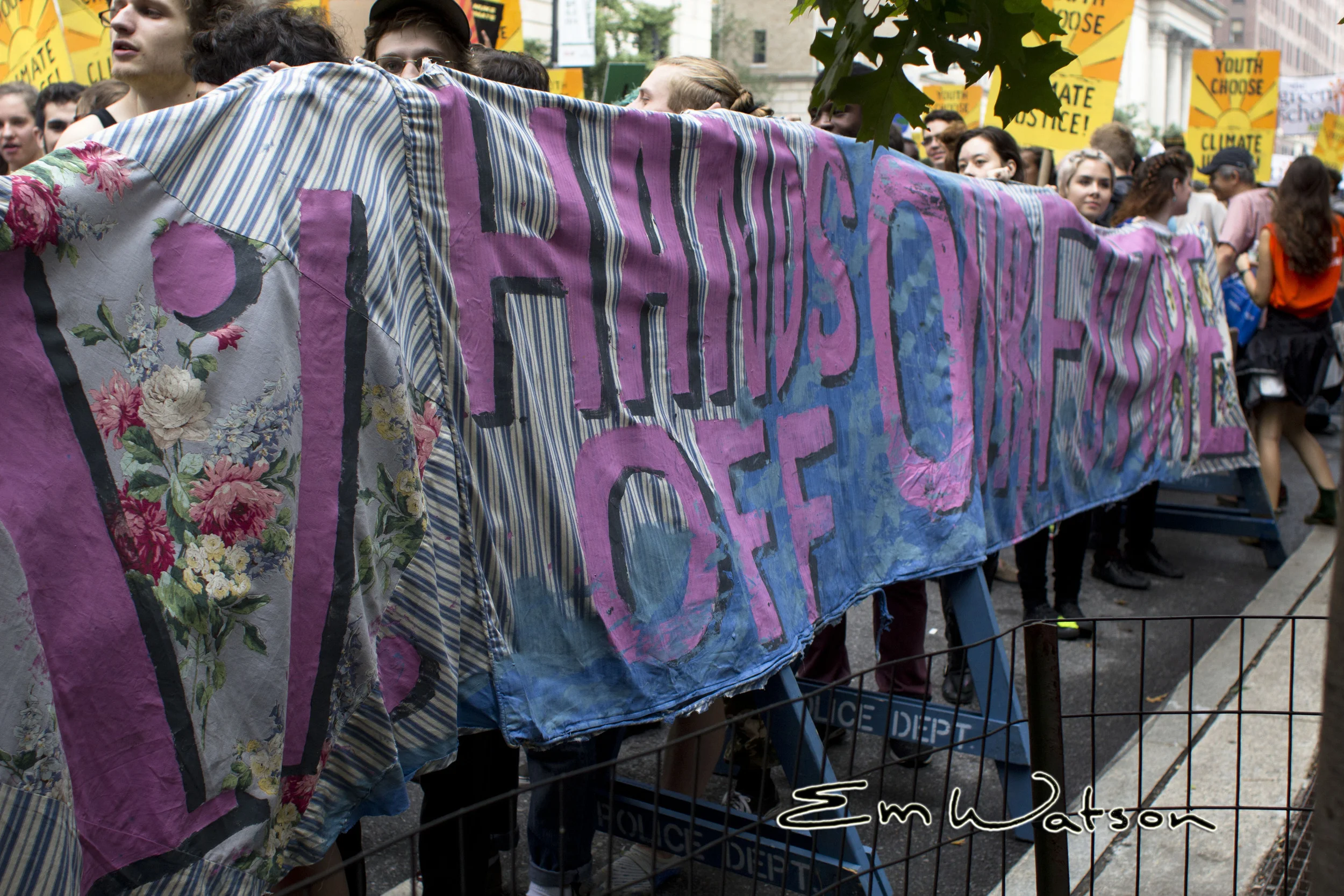 Reads: "1% Hands off our future"