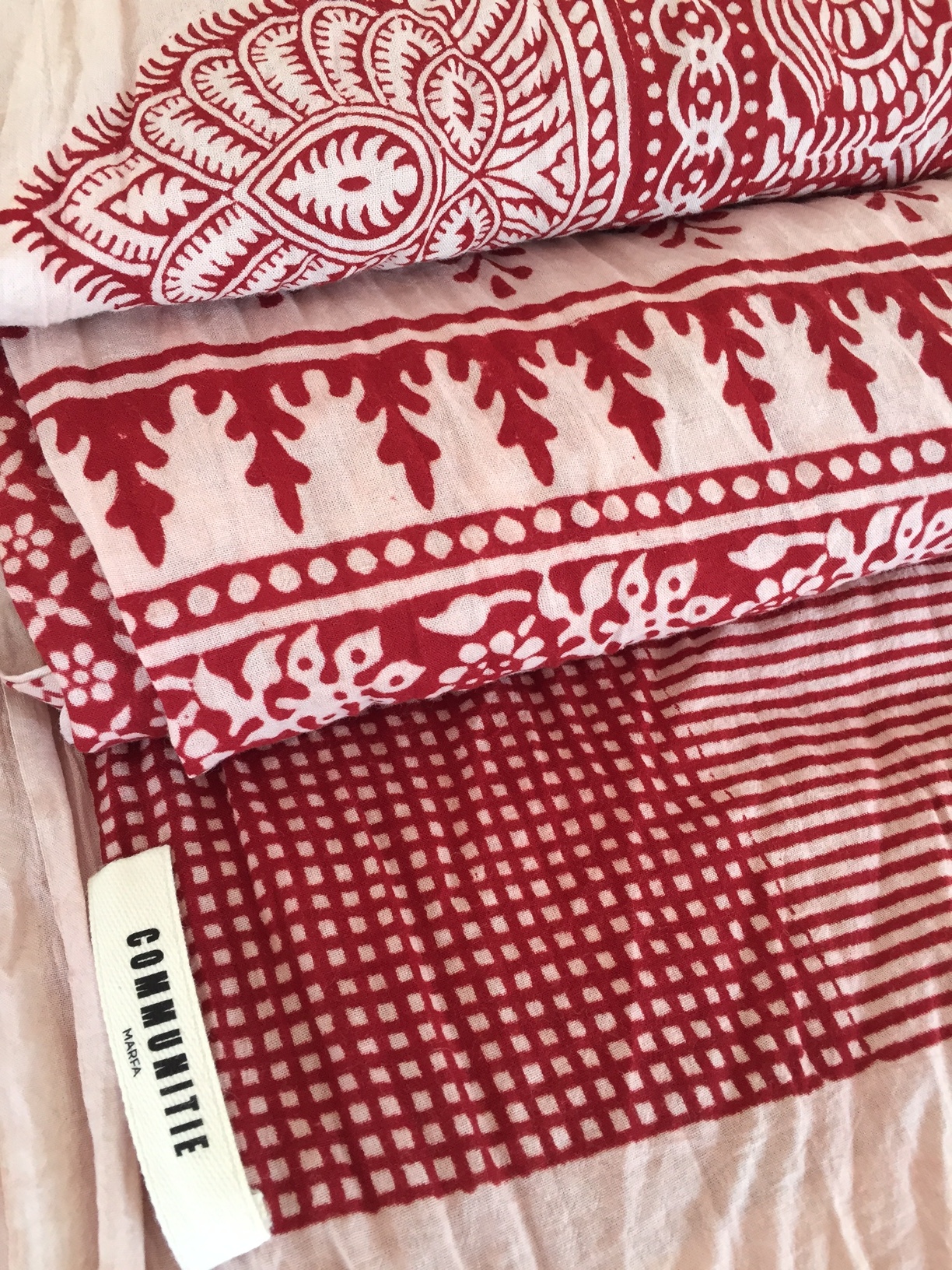 Artisan hand woodblock printed textiles in 100% cotton. Each piece is a one of a kind work of art - style as a scarf, or a beach sarong over swimwear, or a uniquely charming table runner. 
