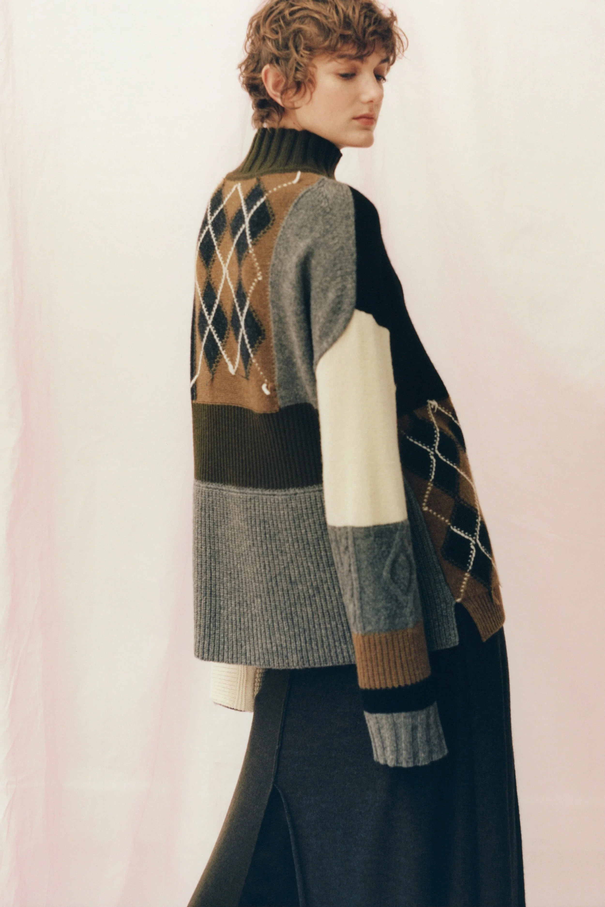 From the archives of Pringle of Scotland, classic patterns are woven together to form this vintage patchwork sweater.