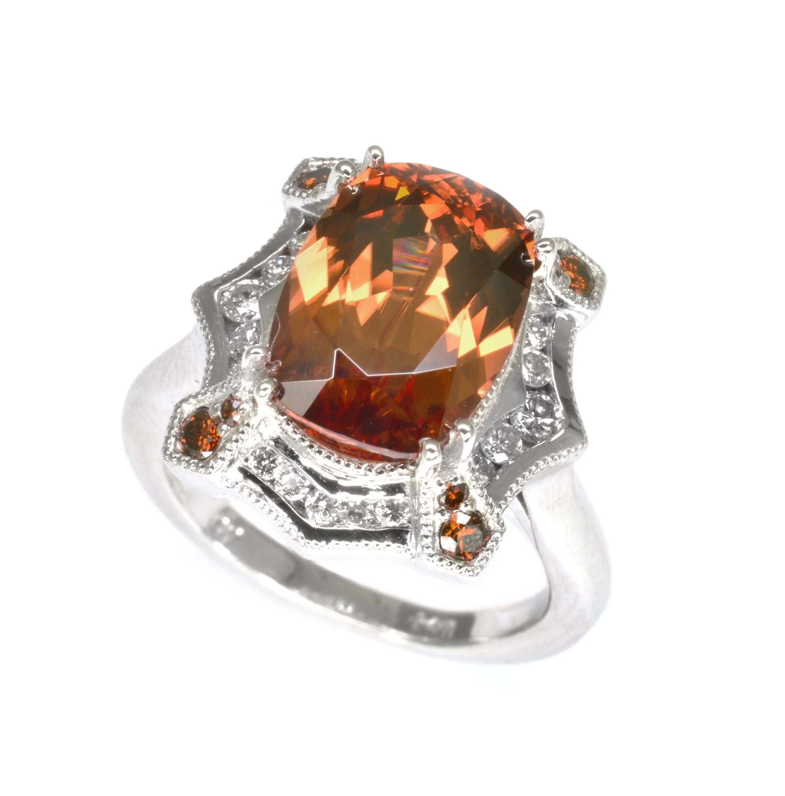 14k white gold ring set with a cinnamon zircon accented with channel set white diamonds and bead set cognac diamonds, designed by Jason Baskin.