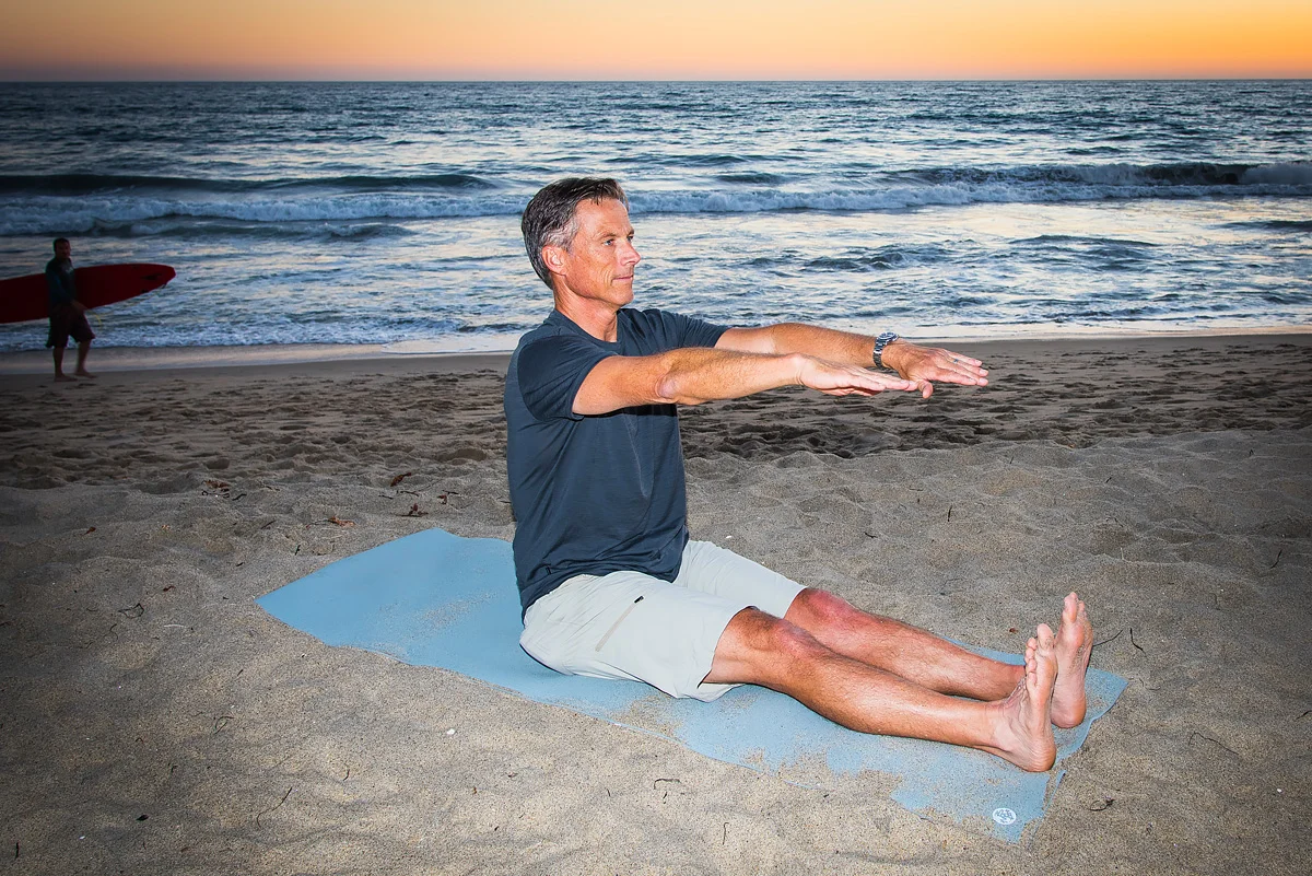 Yes, even surfers like Byron take time for a little Spine Stretch Forward on the beach.
