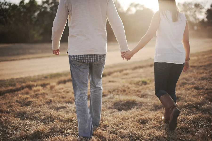 walking into the sun holding hands