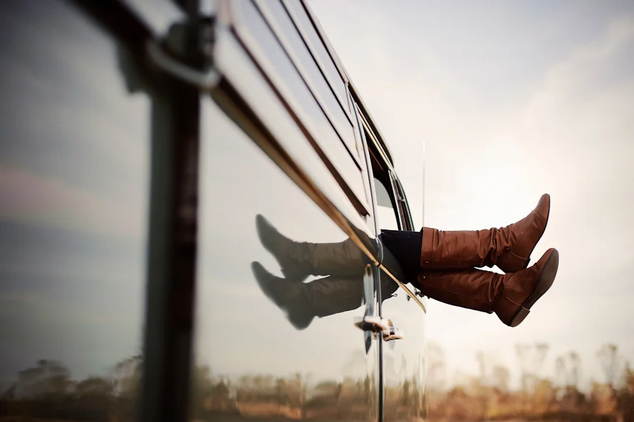 feet hanging out of a vw wagon bus