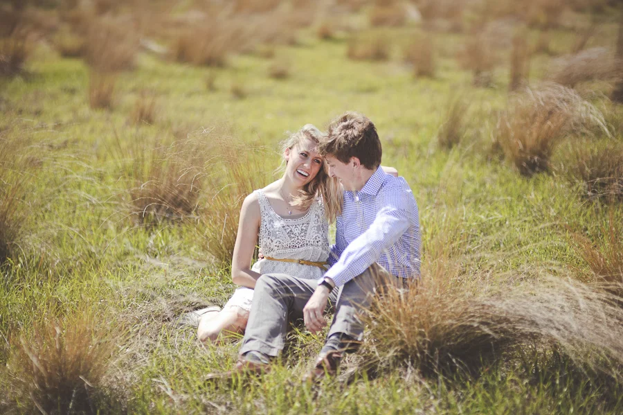 engagement pictures in a field