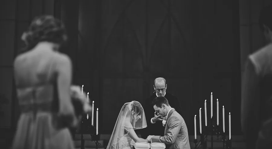 bride and groom at the alter