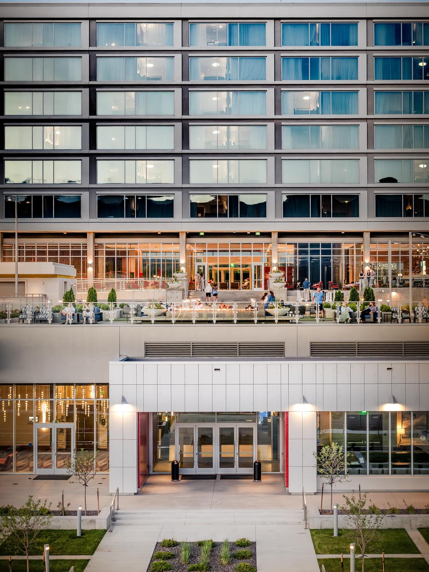 Derived from the academy&rsquo;s late-1950s tectonic form, floor-to-ceiling glass opens the facade to the Rockies beyond, while the amenity deck floats above, layering space for gathering and view.

📸: Christopher R. Vasquez