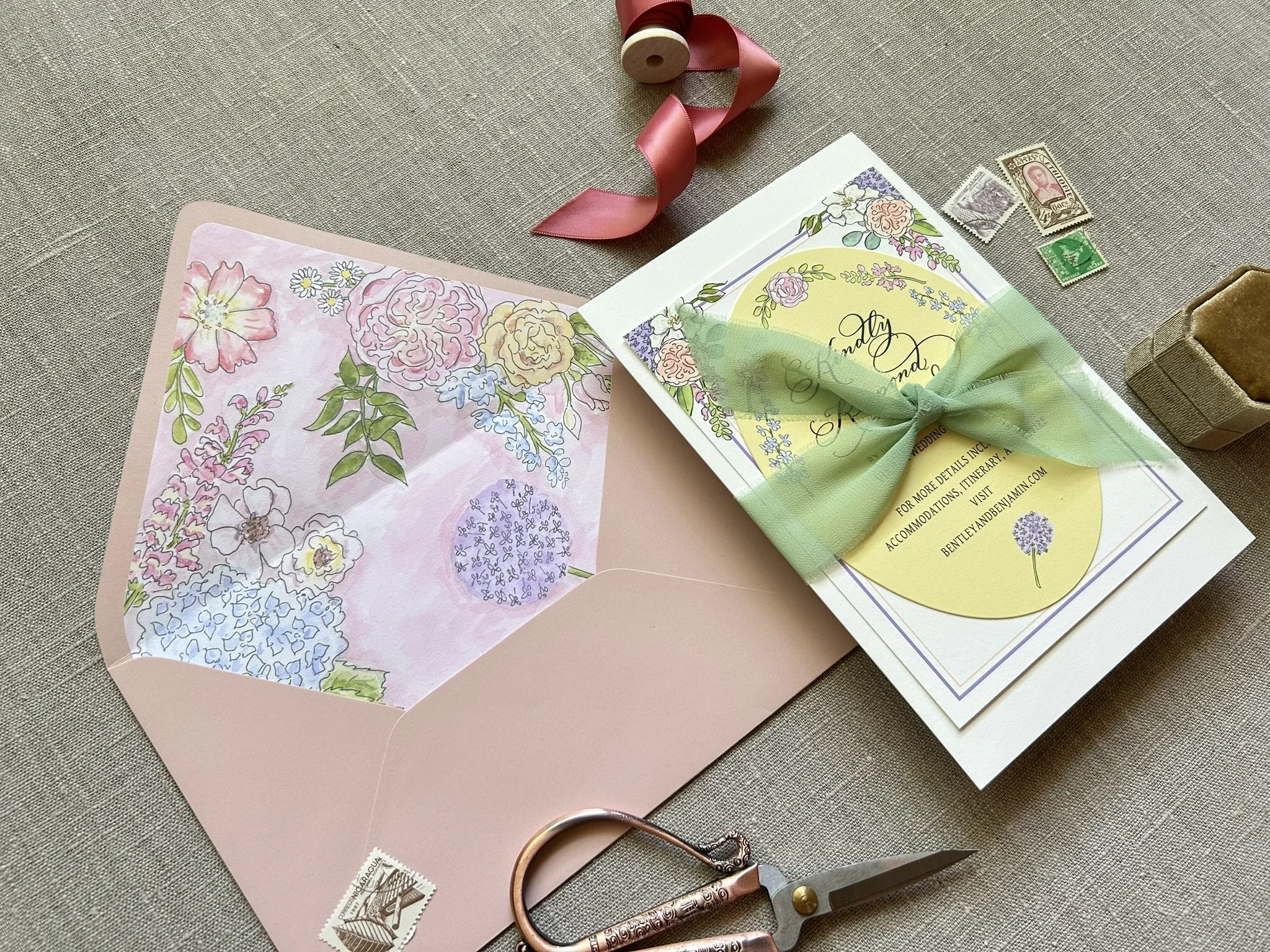 Watercolor and Calligraphy wedding invitations by Robyn Love with floral envelope liners and diecut shape