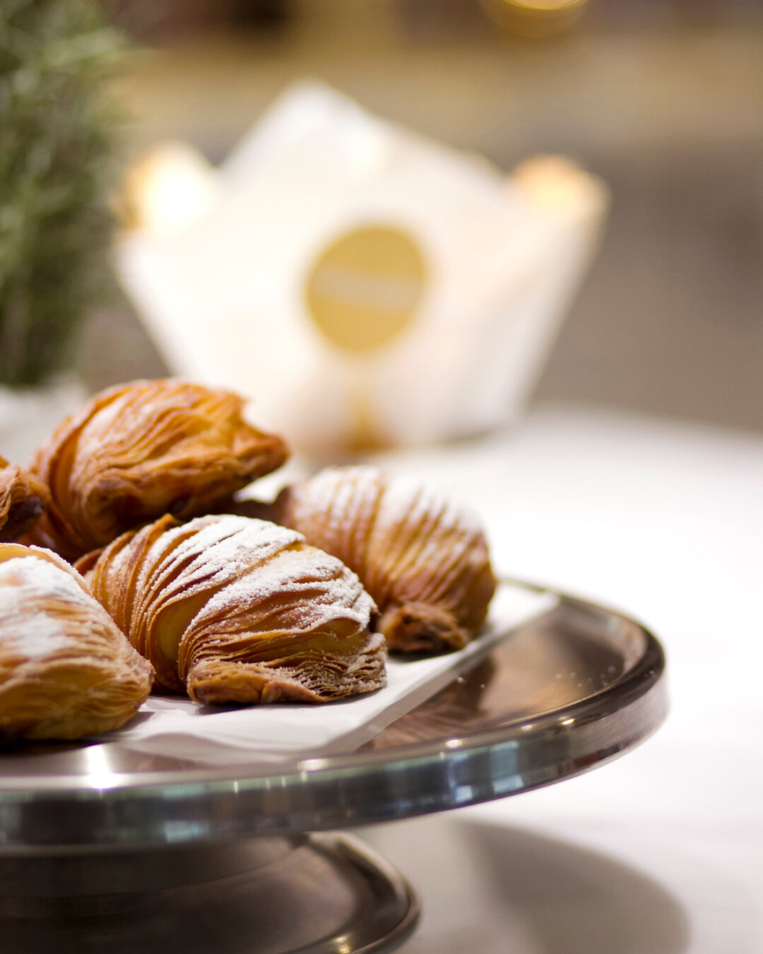 Hailing from Naples, sfogliatella is shell-snapped Italian pastry whose origins date back to the 17th century. Beneath the crispy golden shell lies a soft, citrus infused ricotta filling. Served warm and dusted with icing sugar, it is a favourite of 