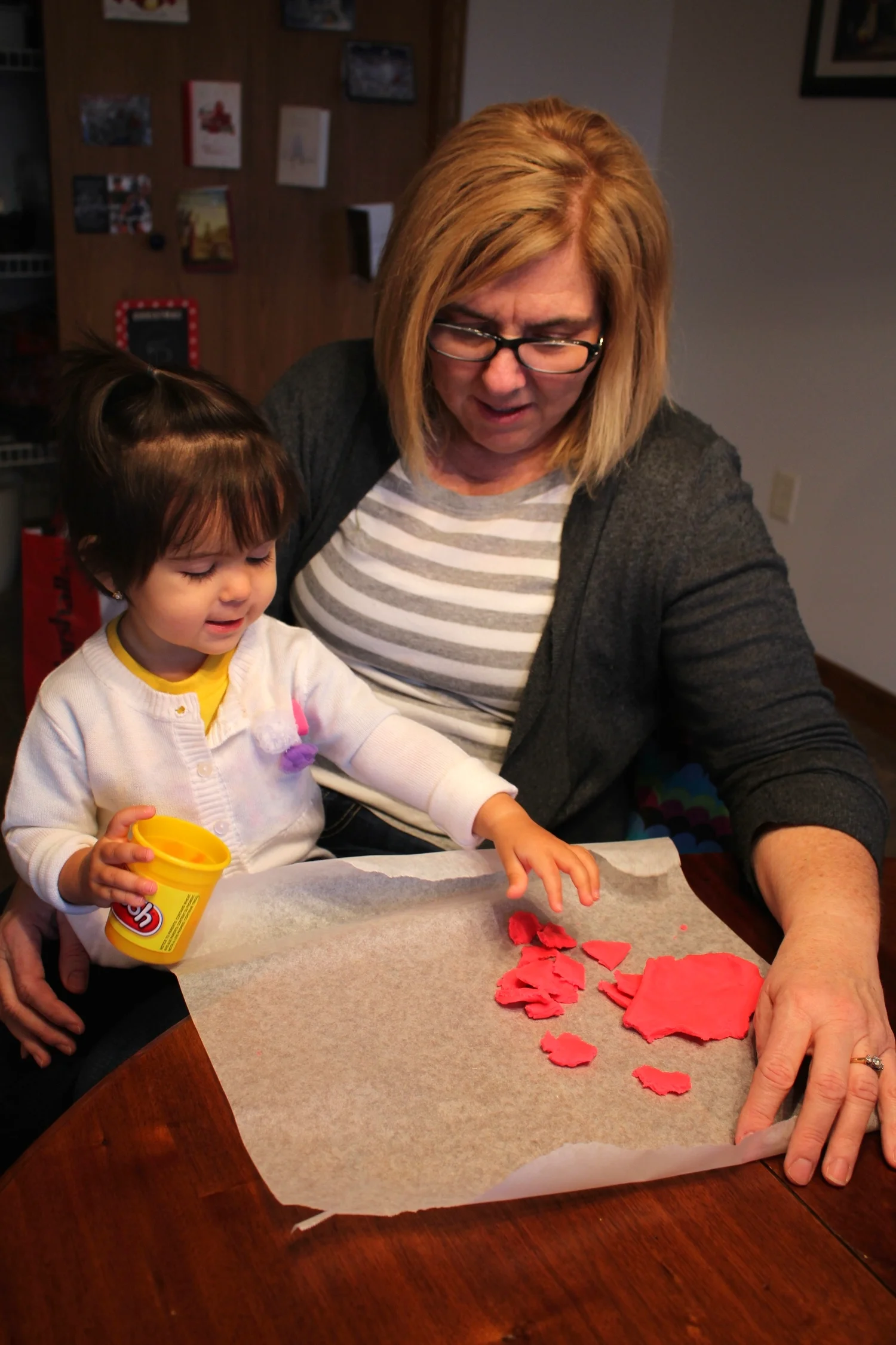 Grandma and Dominika bonding through play-dough.