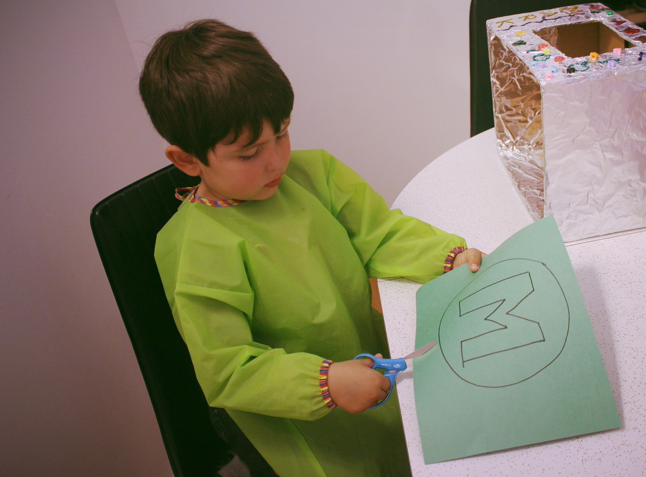Cutting the circle with an M for Mark.