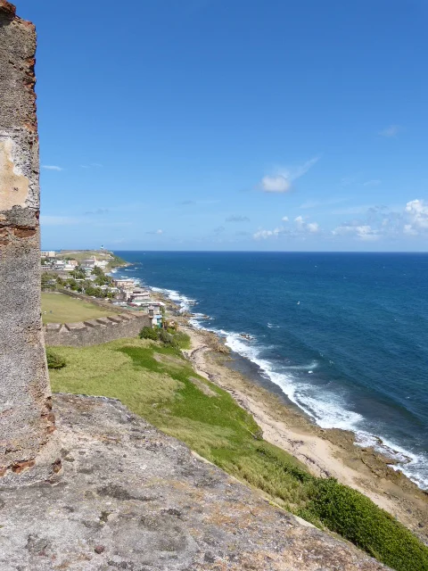 A view of the Caribbean Sea from the fort to the west. You can just barely see the lighthouse of El Morro in the distance. 