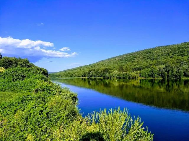 The reception was held in a large pavilion on the banks of the Delaware River, beautifully reflecting the blue sky over the Pocono Mountains.