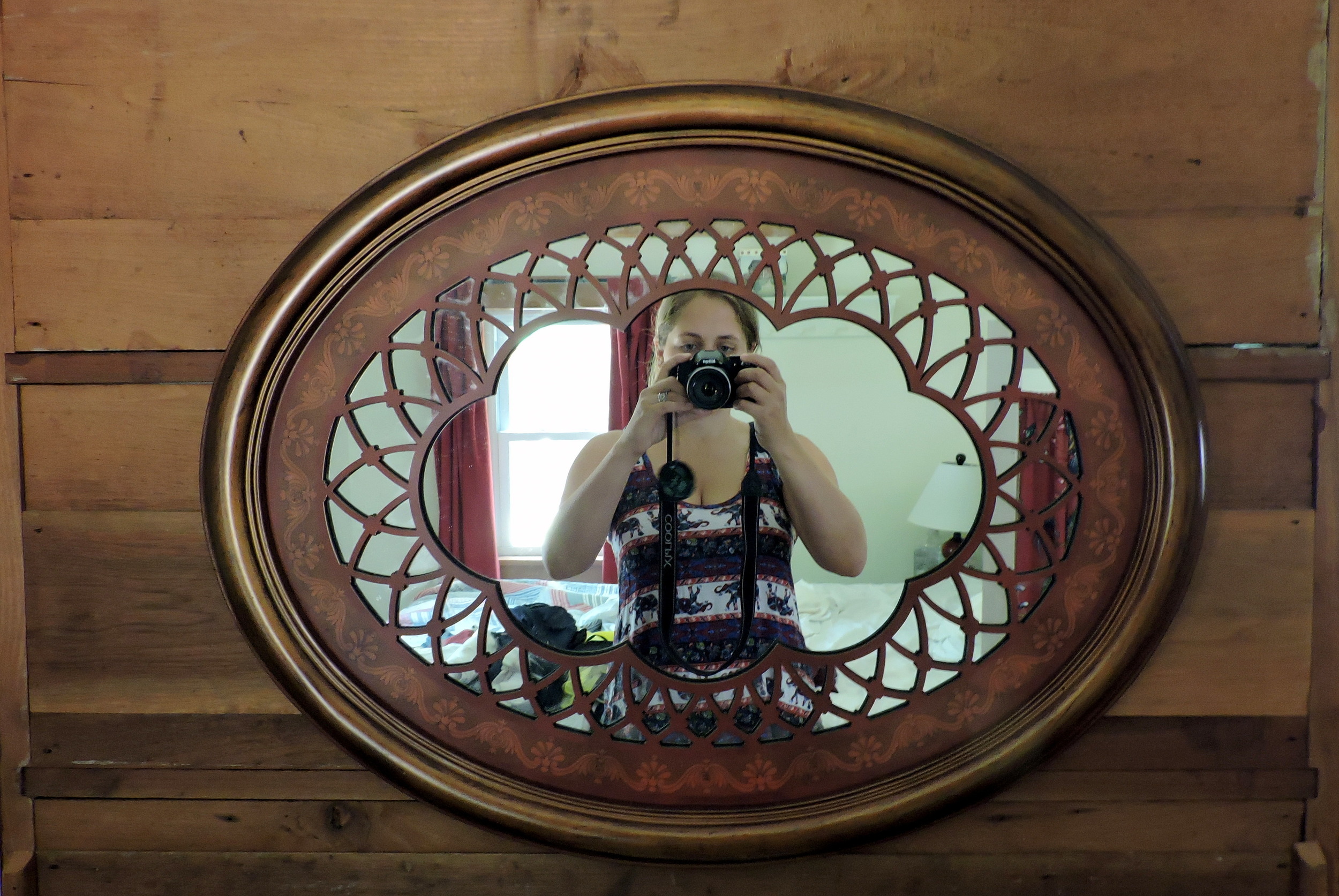 Pictured taking her own picture in the mirror, Ariele is shown here wearing Josh's favorite elephant shirt.
