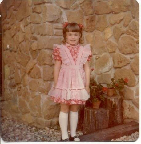 Age 6, dressed up in a costume for her first ever musical, Babes in Toyland .