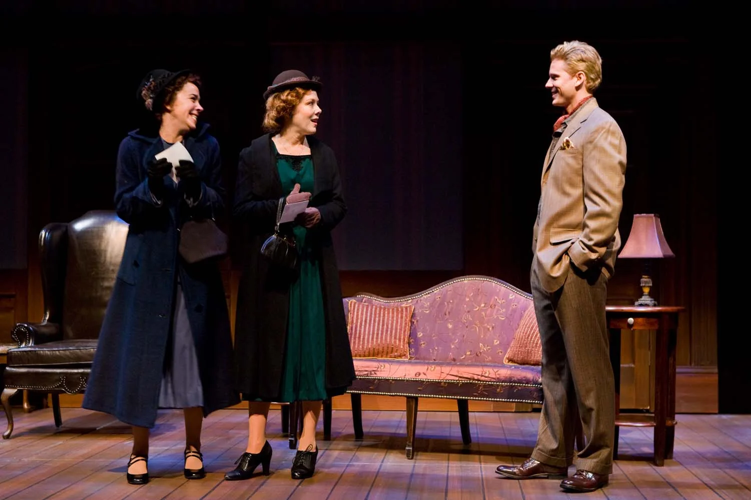 "from gloomy to bright...expertly defined...Designer Maggie Morgan accomplishes...transition with costume. In London, the women (excluding Lady Caroline, who is consistently glamourous), trudge in restricting gray-as-a-winter-sky suits. In Italy, the glide on and offstage in lightweight spring-colored dresses..." K.M. Sarver, Midtown Messenger 10/20/08