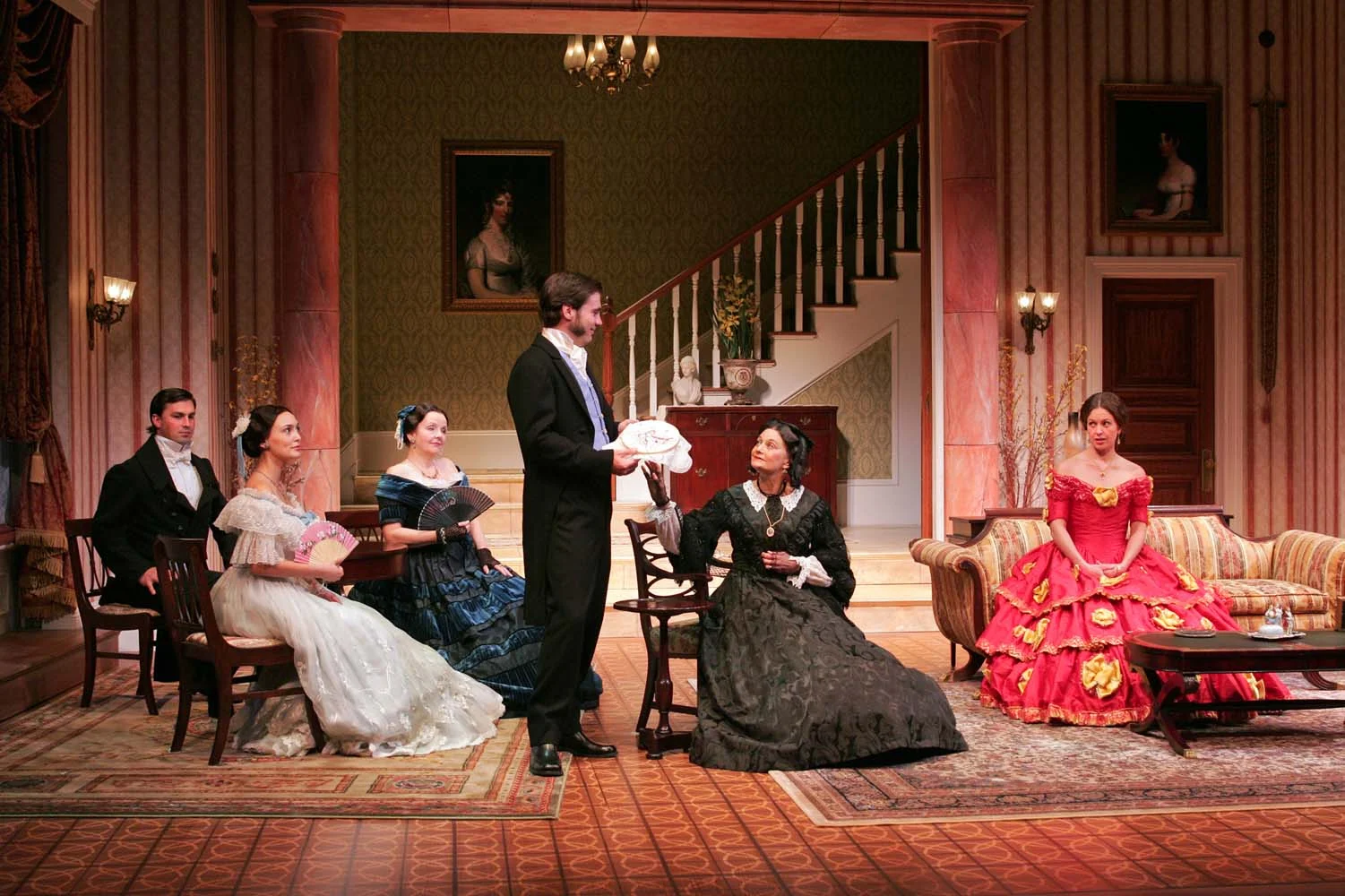 Orange County Register Review "Maggie Morgan's costumes communicate many nuances of character. Catherine's garishly red ball gown is perfectly not-quite-right – the choice of a socially insecure young woman uncomfortable with New York's high-society rules and manners. The work of Buderwitz and Morgan are part of an impressive synergy in Benson's elegant staging." Paul Hodgins 10/26/08