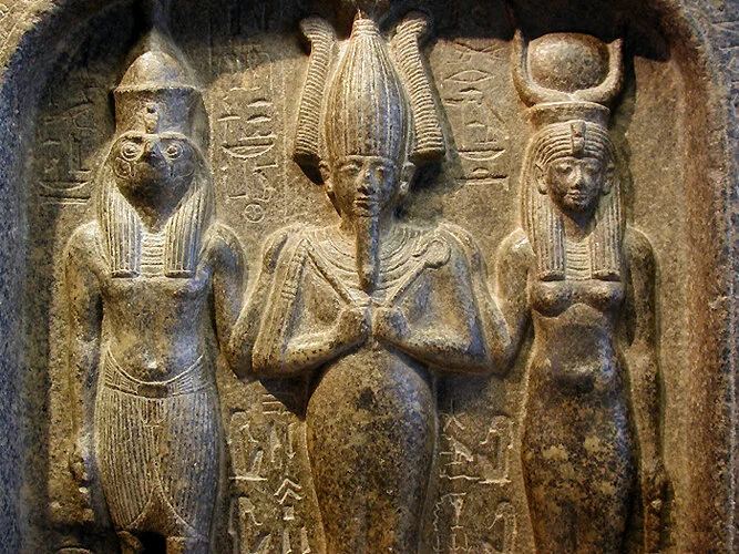 Image of the ancient holy trinity: God The Father and Son; Goddess Mother and Daughter; Gods Of Our Ancestors — Our Holy Spirits …. (From l-r): Lord heru. god ausar. goddess auset. — in later years in egyptian pantheon, god ausar would become known as amun-ra, ra-the sun god, Osiris, et al. — goddess auset, also known as goddess, ma’at (Ma’yet) among nubian tribes, and would later become known as nefertiti, isis, et al — Lord Heru would later become known as horus, the Sky God, but he was also known as God of War, Hunter's God, God of Kingship, et al.