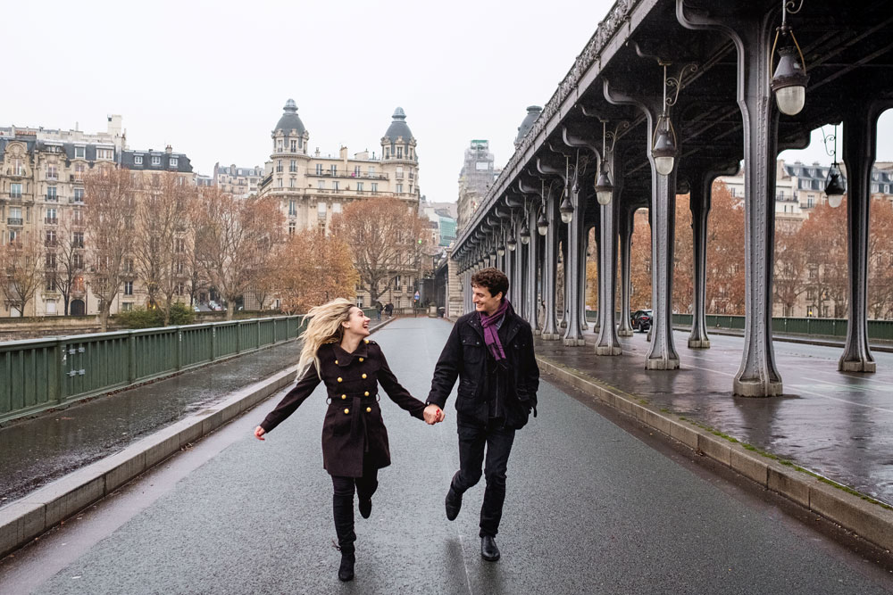 Paris-photographer-Paris-for-Two-Christian-Perona-engagement-blue-dress-love-pre-wedding-proposal-rain-rainy-day-inception-shoot-photoshoot-Bir-Hakeim-bridge.jpg