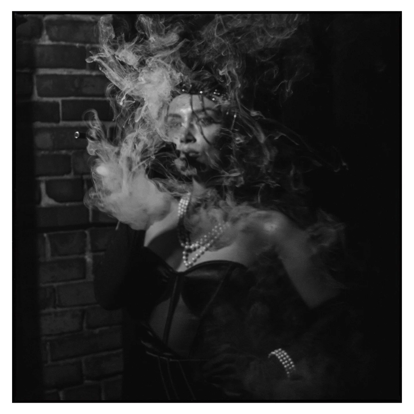 &ldquo;I slipped through the velvet curtain of the juke joint, where smoke hung low and jazz rattled the glassware. I was halfway to my usual table when I saw her, curled in the corner like the night would never end, a long cigarette holder lifting s