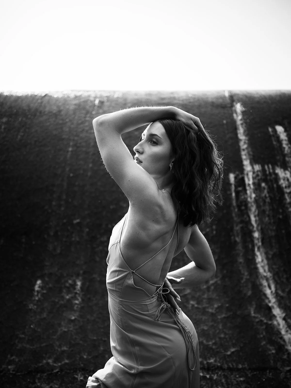 Black and white back portrait against the waterfall