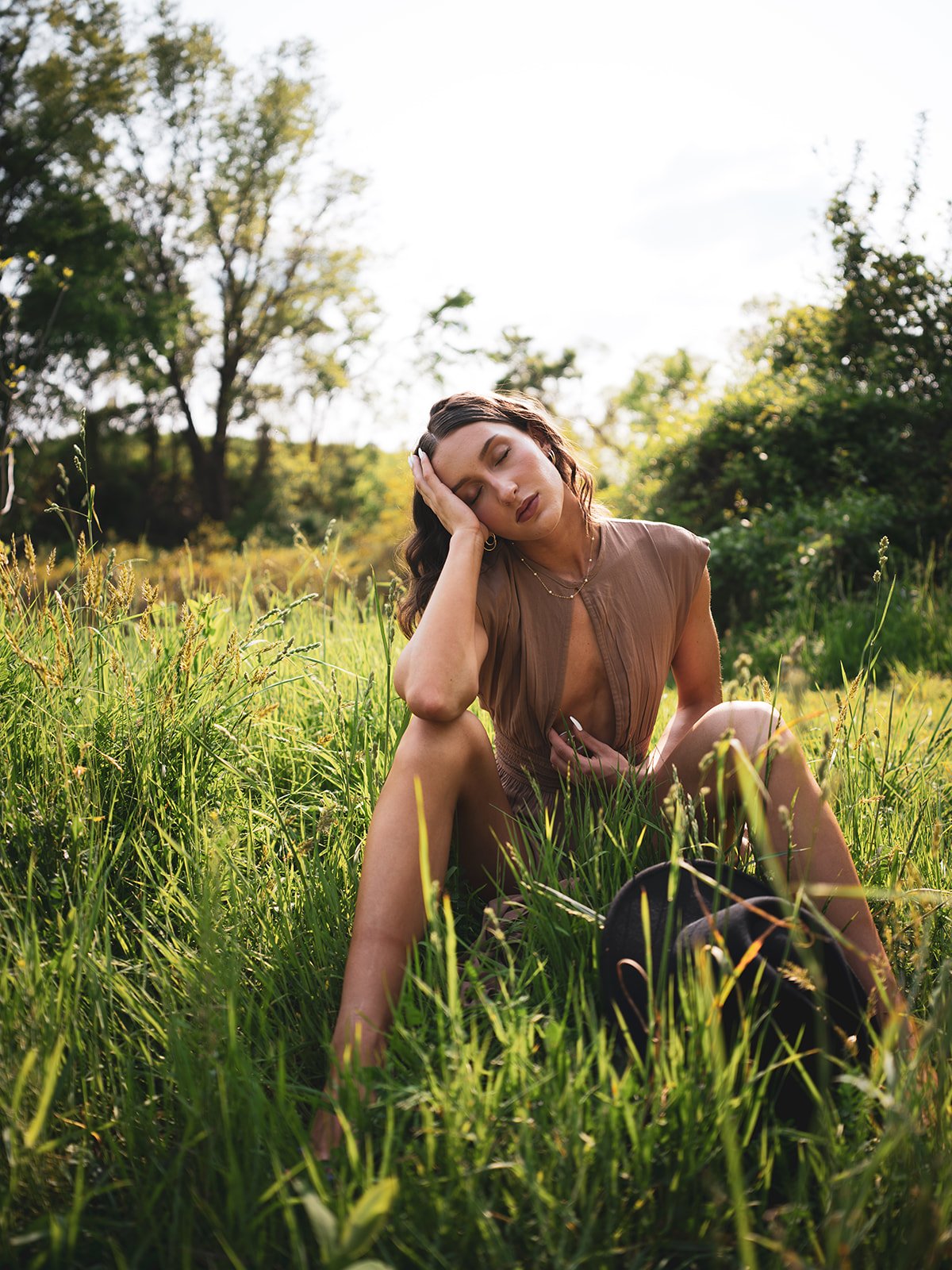Portrait resting in tall summer grass