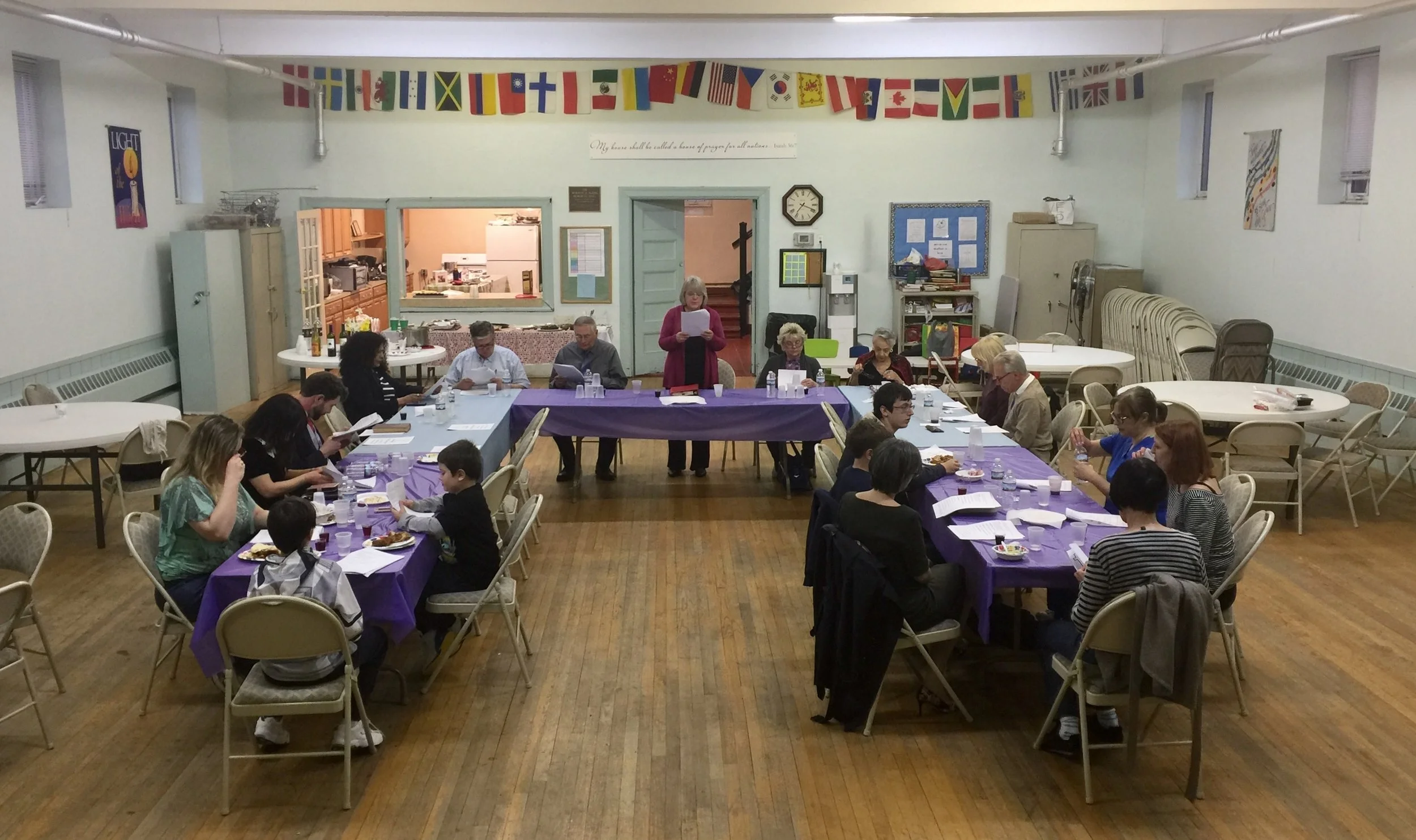 Pastor Lynn conducting our Holy Thursday Fellowship Meal at QHCC's Fellowship Hall