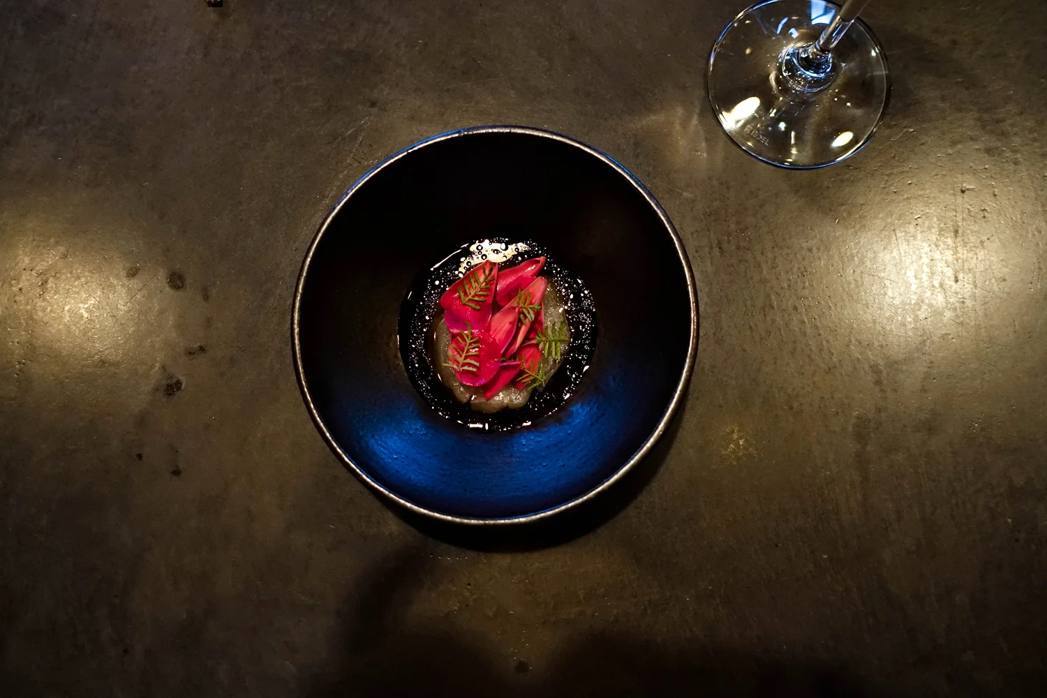 Black Bass with artichoke petals, mushroom and Marigold with tagetes