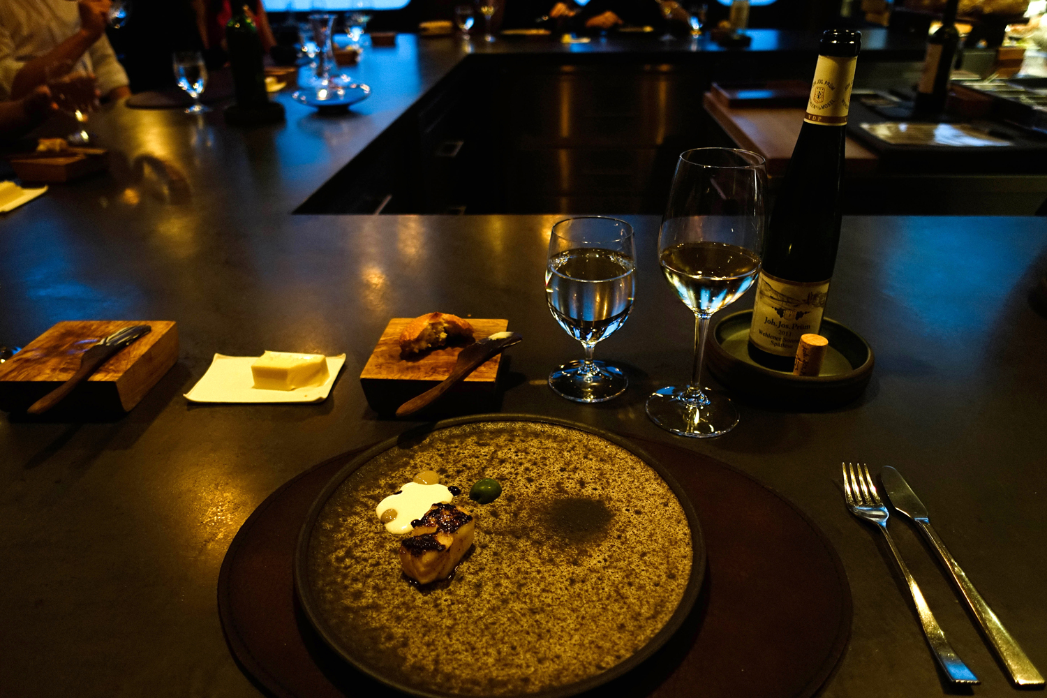 Cod with black walnut, olive and Chamomile with matricaria recutita