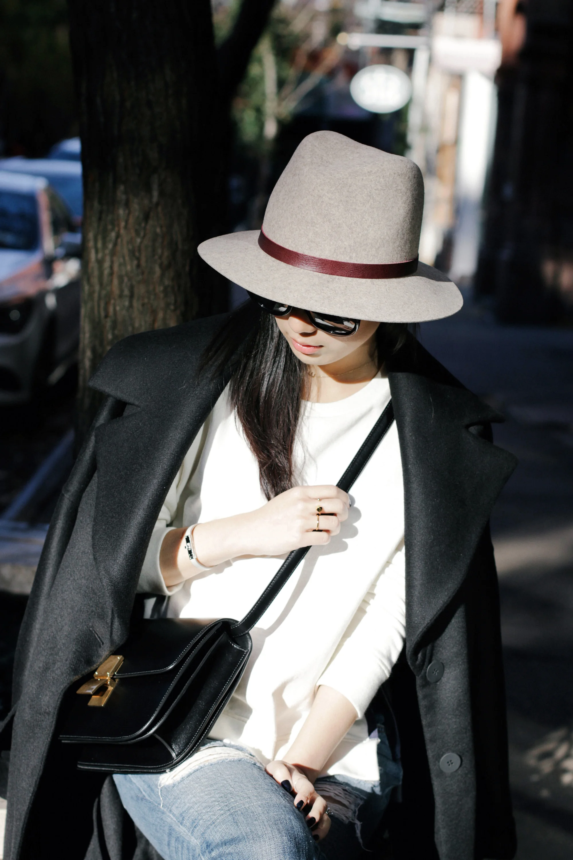 Michelle Waugh Coat , Acne Studios Top, Rag & Bone Jeans, Camilla Skovgaard Boots , Céline Bag, Janessa Leone Hat , The Row Sunglasses ( Tortoiseshell ), Hermes Bracelet ( Black ), Brandy Pham Rings ( One , Two )