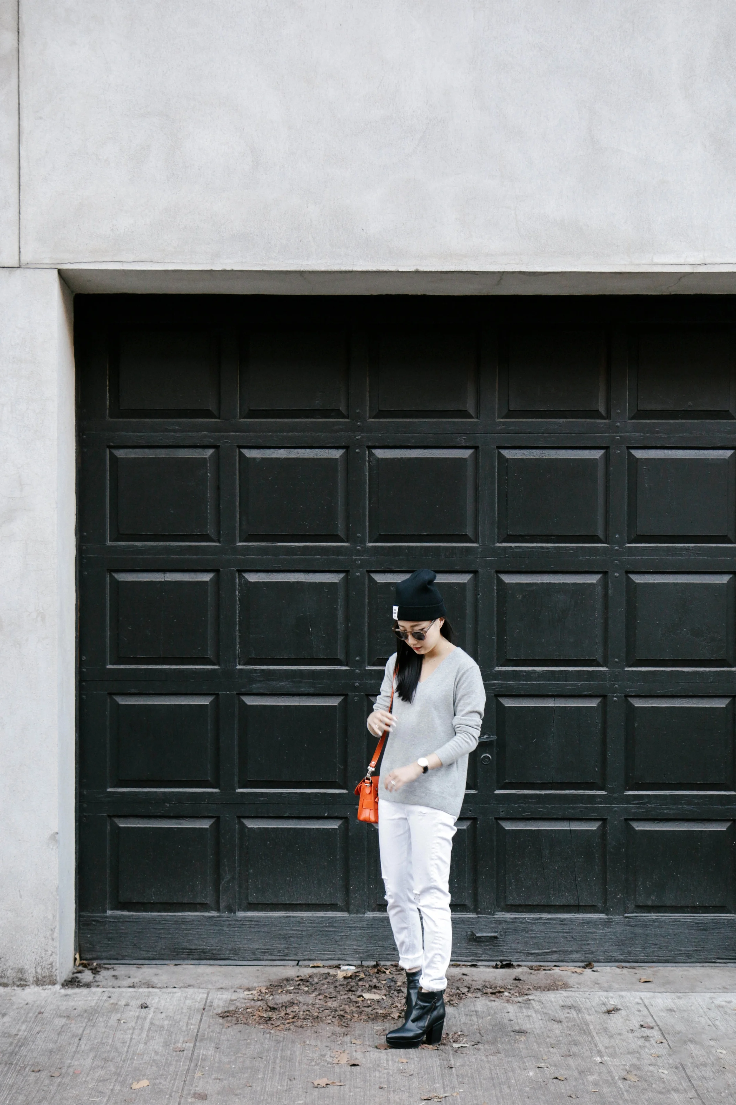 Stella McCartney Coat , Everlane Sweater , Rag & Bone Jeans, Acne Studios Boots , Proenza Schouler Bag ( in Black ), COS Scarf , Cutler and Gross Sunglasses , Opening Ceremony Beanie , Daniel Wellington Watch , AVEC New York Ring , Catbird Rings