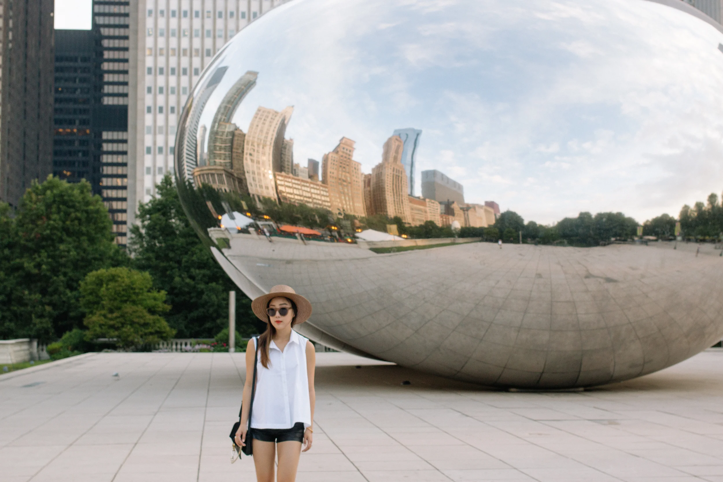 Maud Heline Top , J Brand Shorts, Chloe Bag , Chanel Shoes, Cutler & Gross Sunglasses , Janessa Leone Hat , Céline Bracelet, Mirlo Jewelry , AVEC New York Jewelry