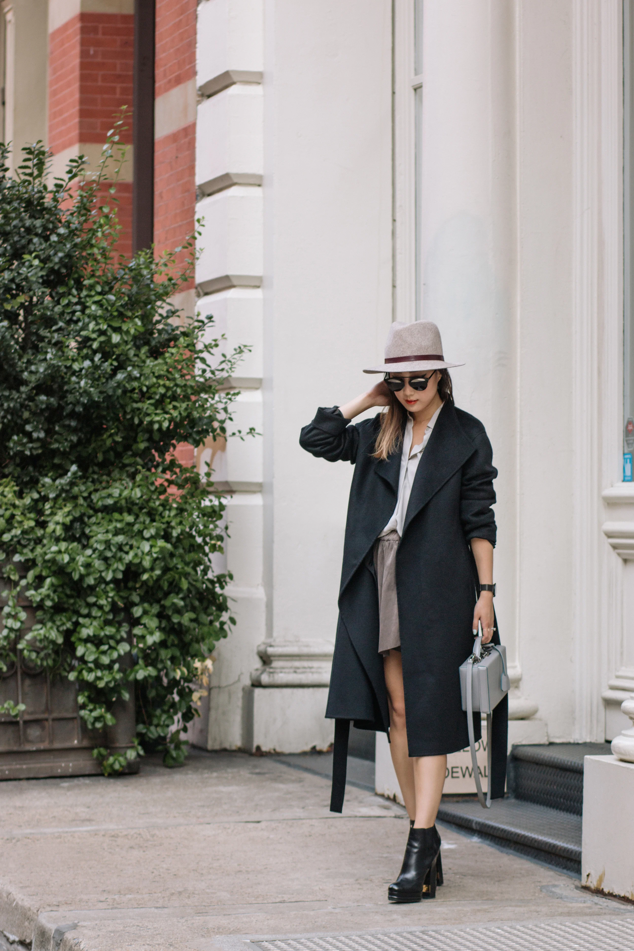 Kuho Coat, Everlane Shirt , Aritzia Skirt , Chanel Shoes, Janessa Leone Hat , Mark Cross Bag , Dior Sunglasses , Larsson & Jennings Watch