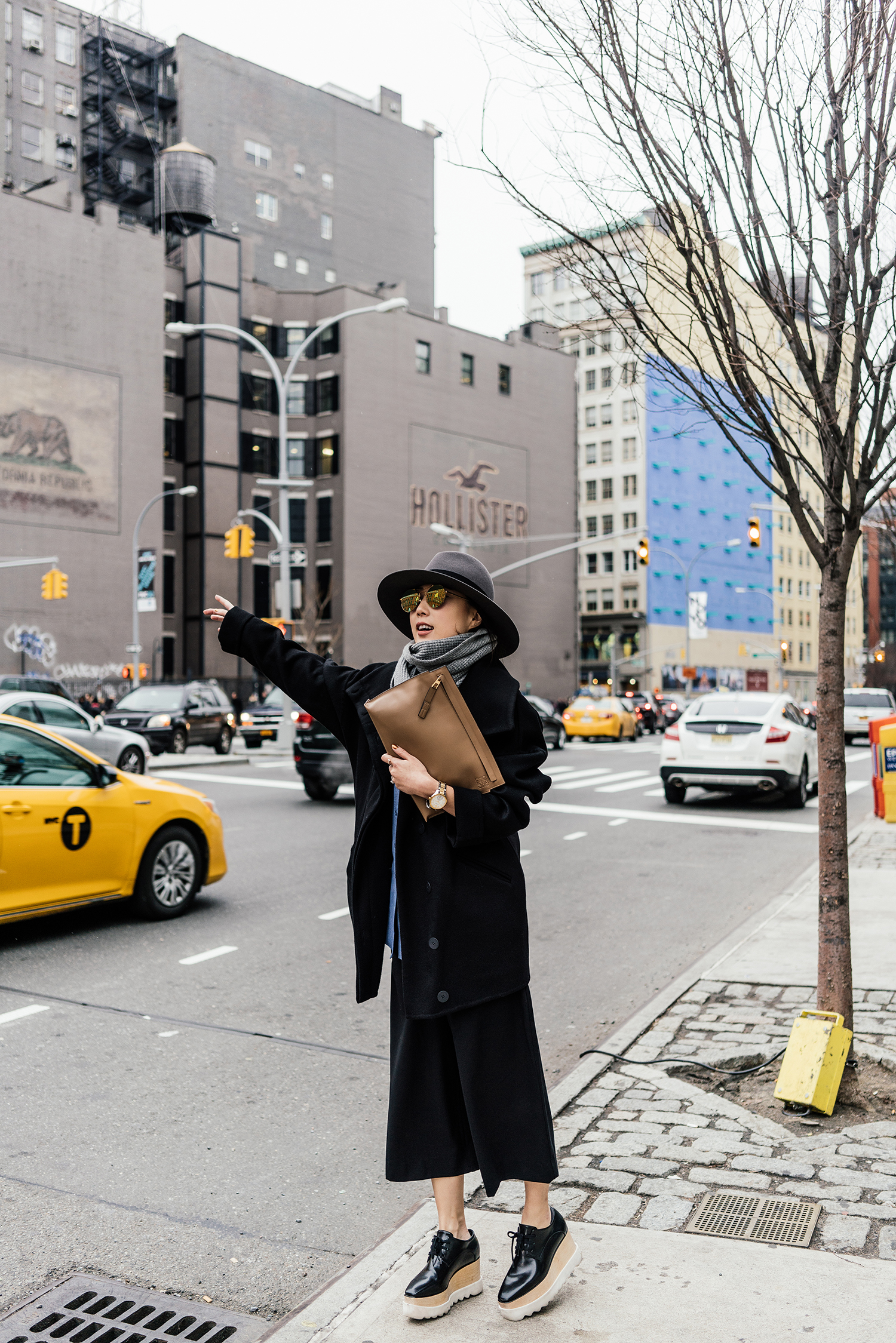 Movado Watch , Michelle Waugh Coat , C/meo Collective Top , COS Pants, Stella McCartney Shoes , Loewe Clutch , Saint Laurent Hat, Candy & Caviar Scarf , Gentle Monster Sunglasses