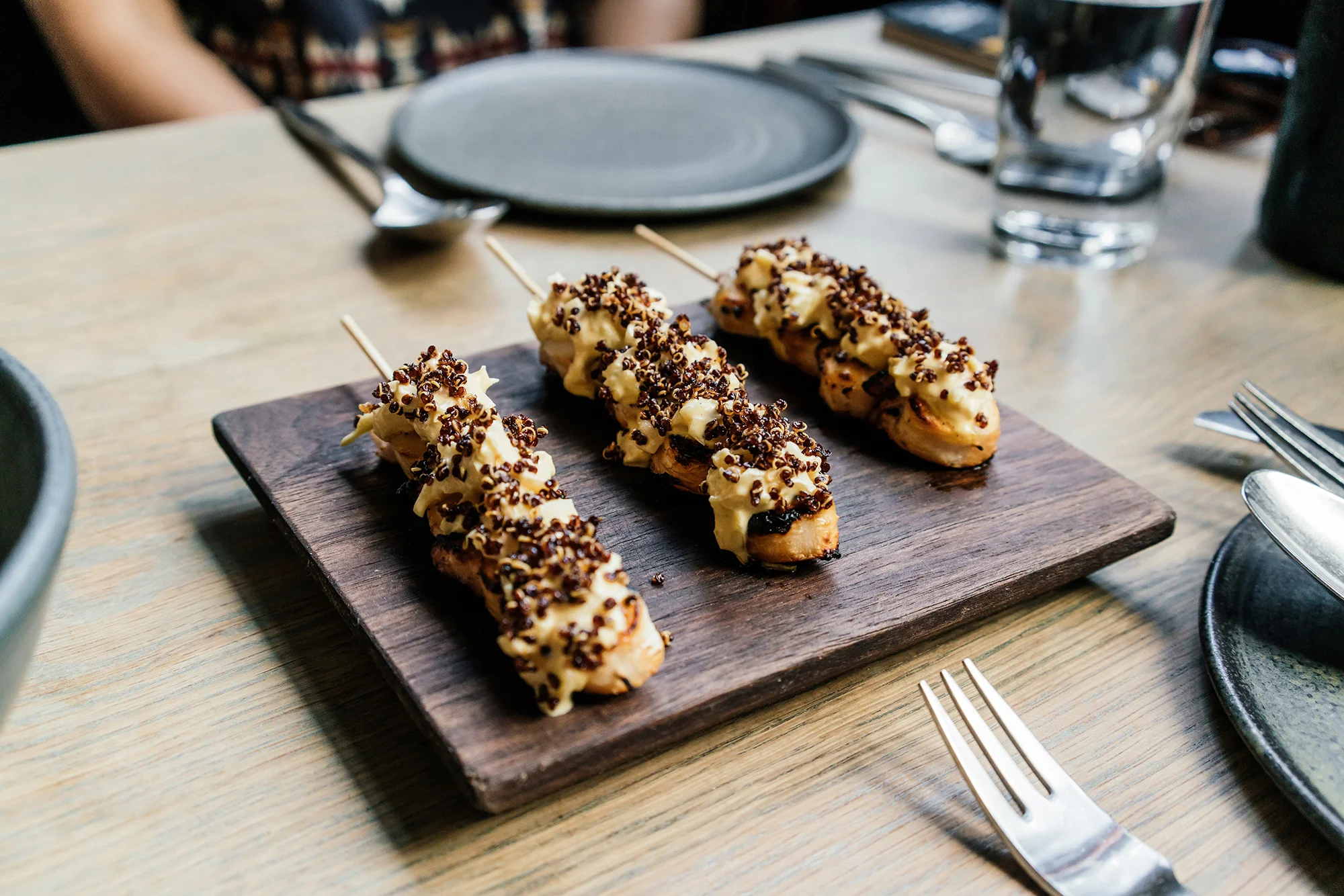 Dinner (shown here: octopus skewers) at Llama Inn