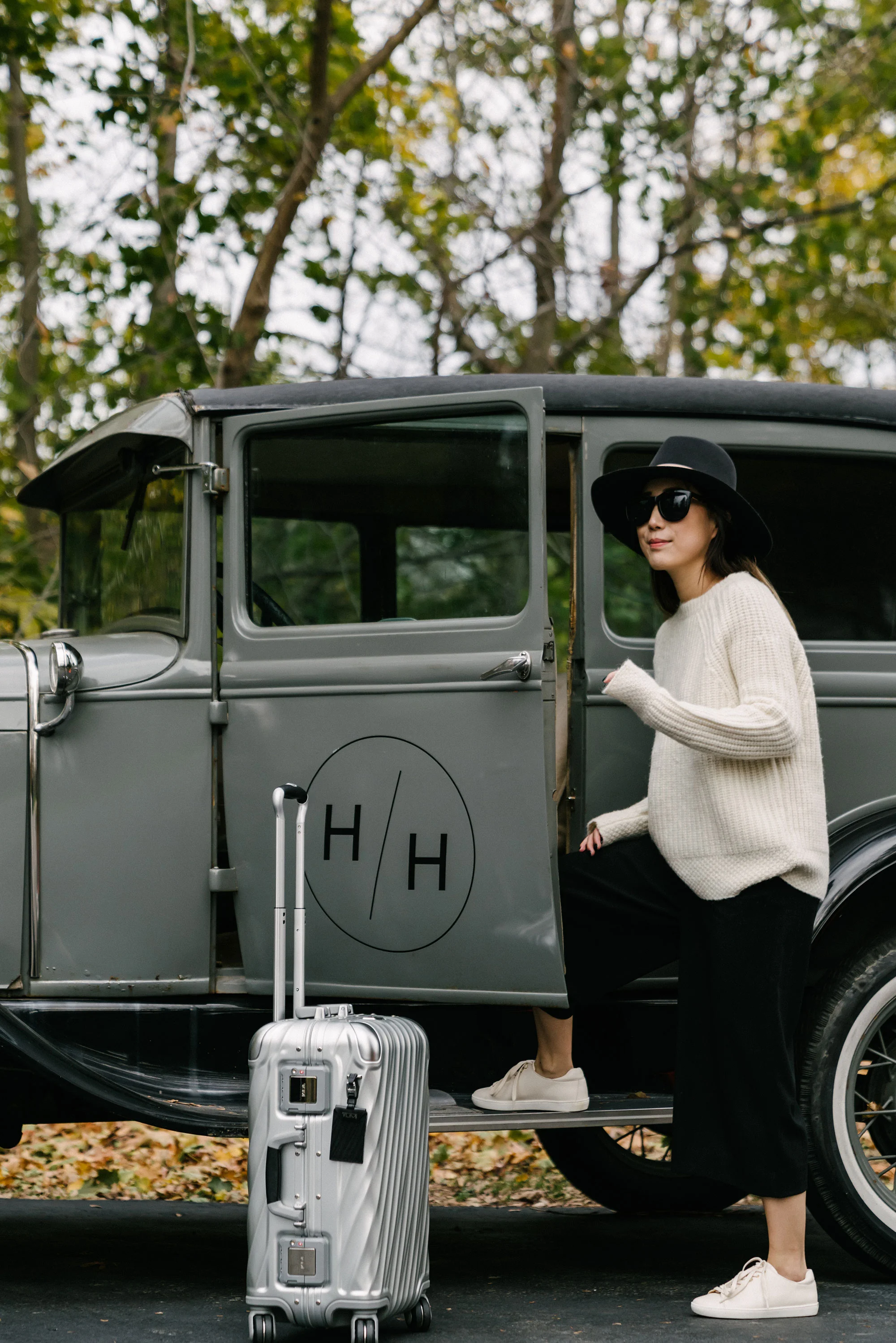 Nili Lotan Sweater , COS Pants, Sezane Shoes , Janessa Leone Hat , Tumi Luggage