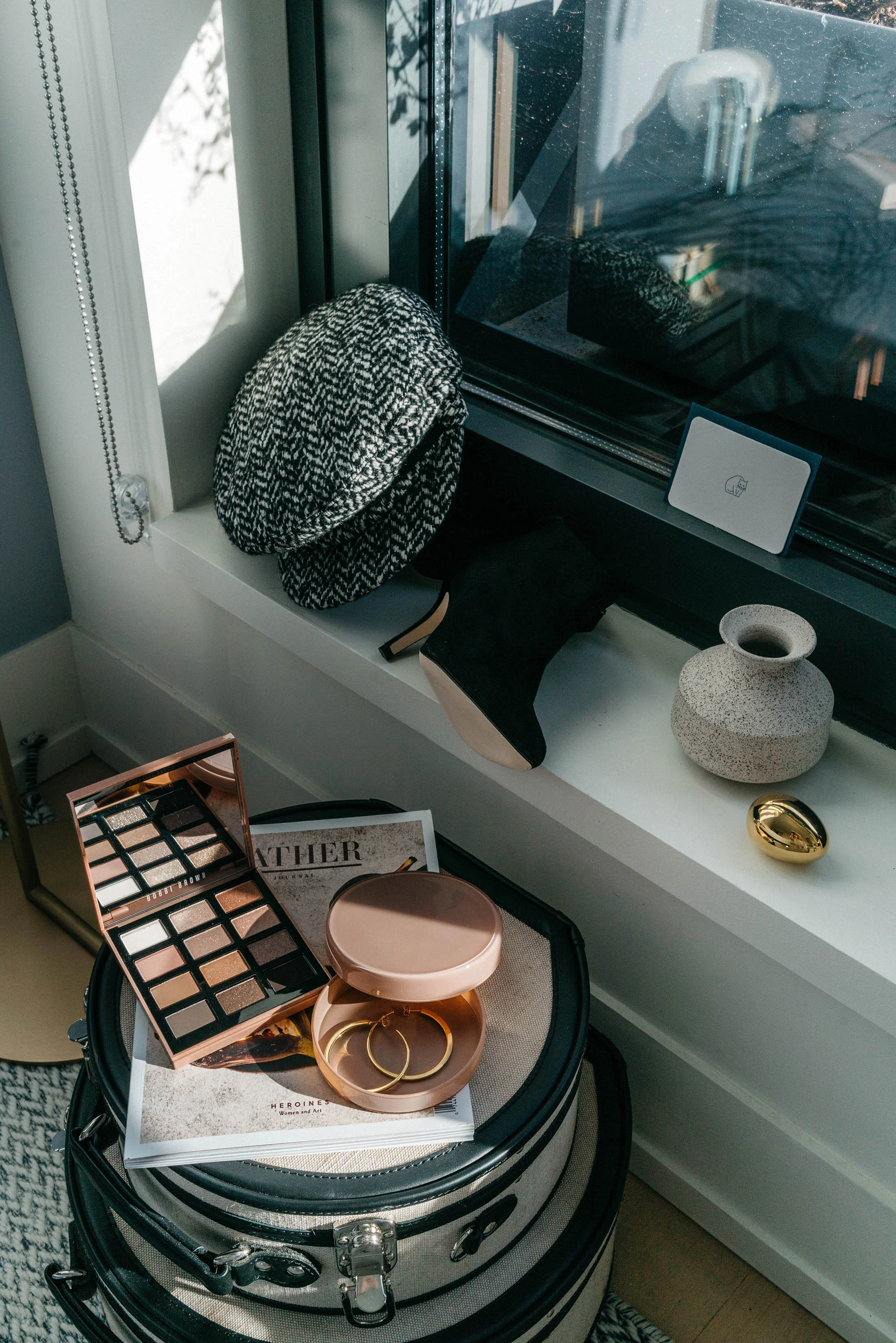 Eugenia Kim Hat , Yvonne Kone Heels , Carl Aubock Egg , Bobbi Brown Palette, Vita Fede Earrings