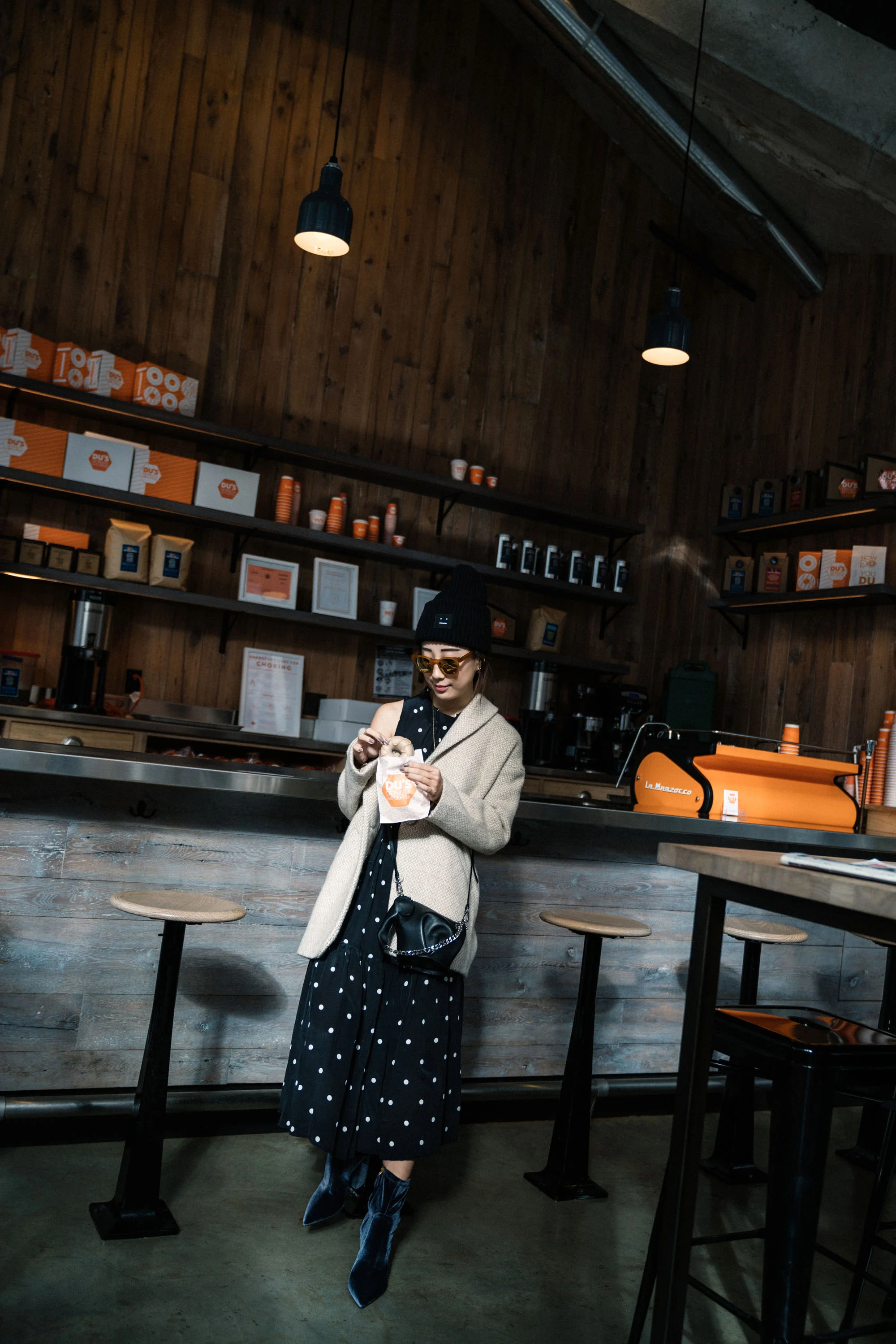 Sezane Jacket , Asceno Dress , Prada Boots, Loewe Bag, Acne Studios Beanie, Oliver Peoples Sunglasses , Cartier Necklace