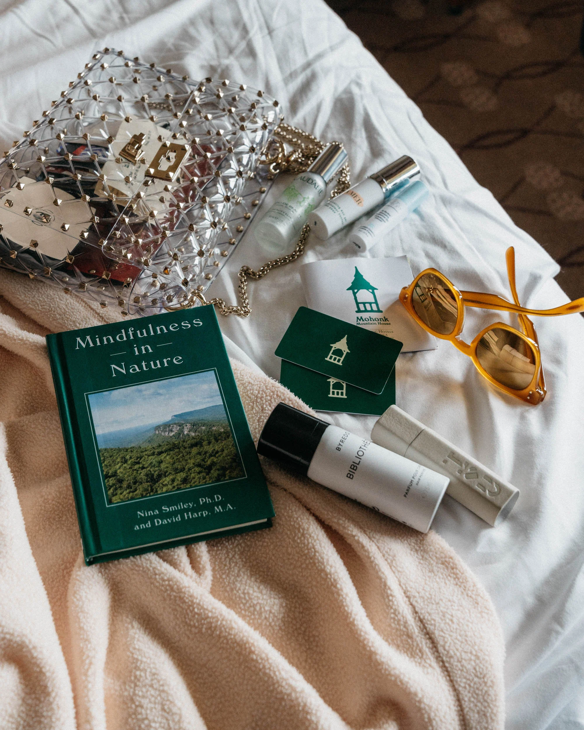 Valentino Bag , Oliver Peoples Sunglasses, Byredo Hair Mist , Byredo Perfume , Caudalie Mist , La Mer Eye Gel , Drunk Elephant Gel