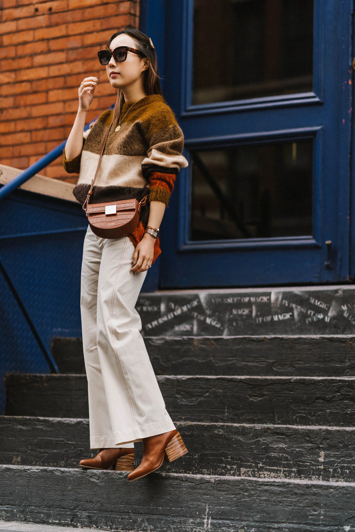 Acne Studios Sweater, SEA New York Pants , Gabriela Hearst Boots, Demelier Bag , Céline Sunglasses, Cartier Watch