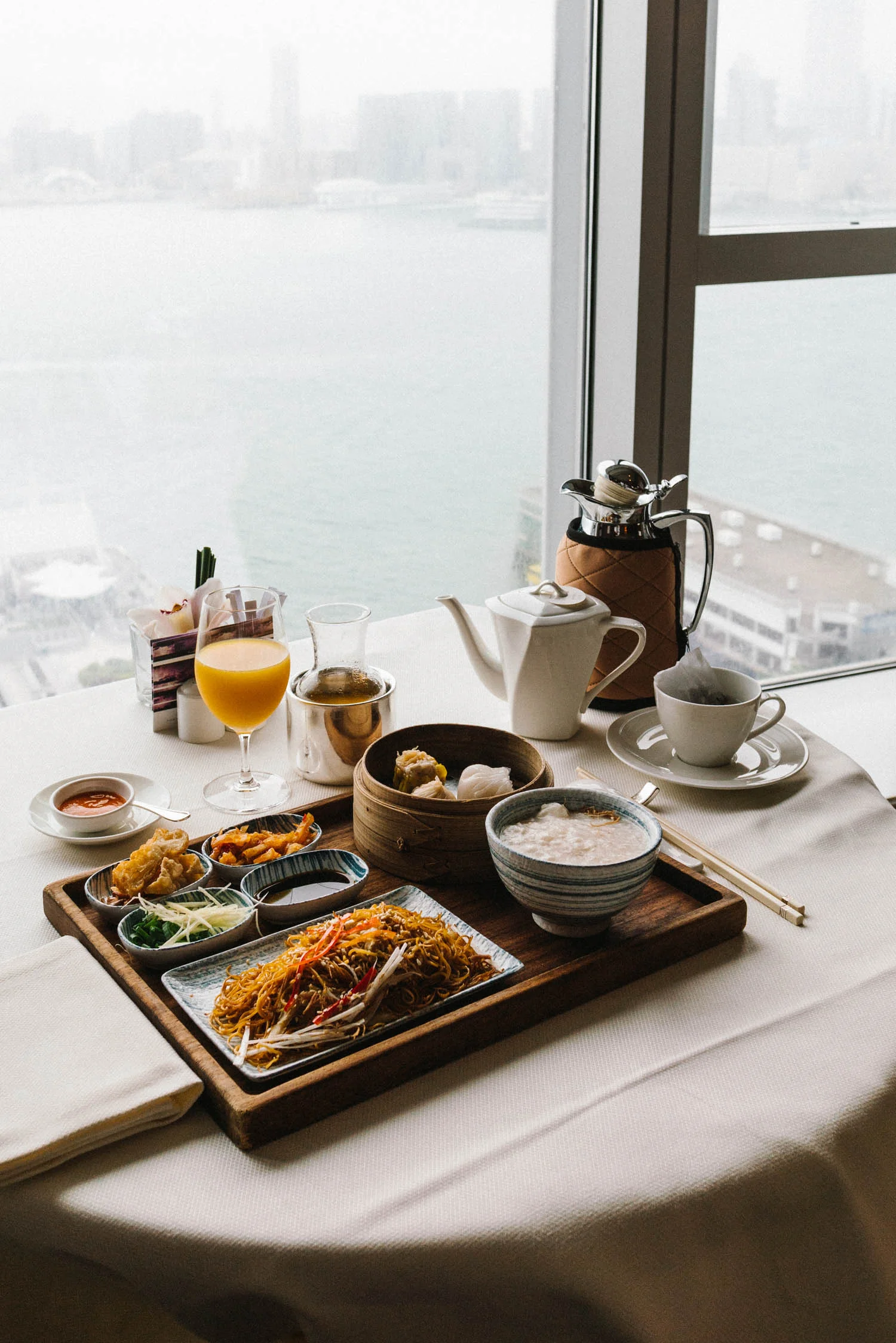 Chinese breakfast of congee, dimsum, and stir-fried noodles for in-room dining