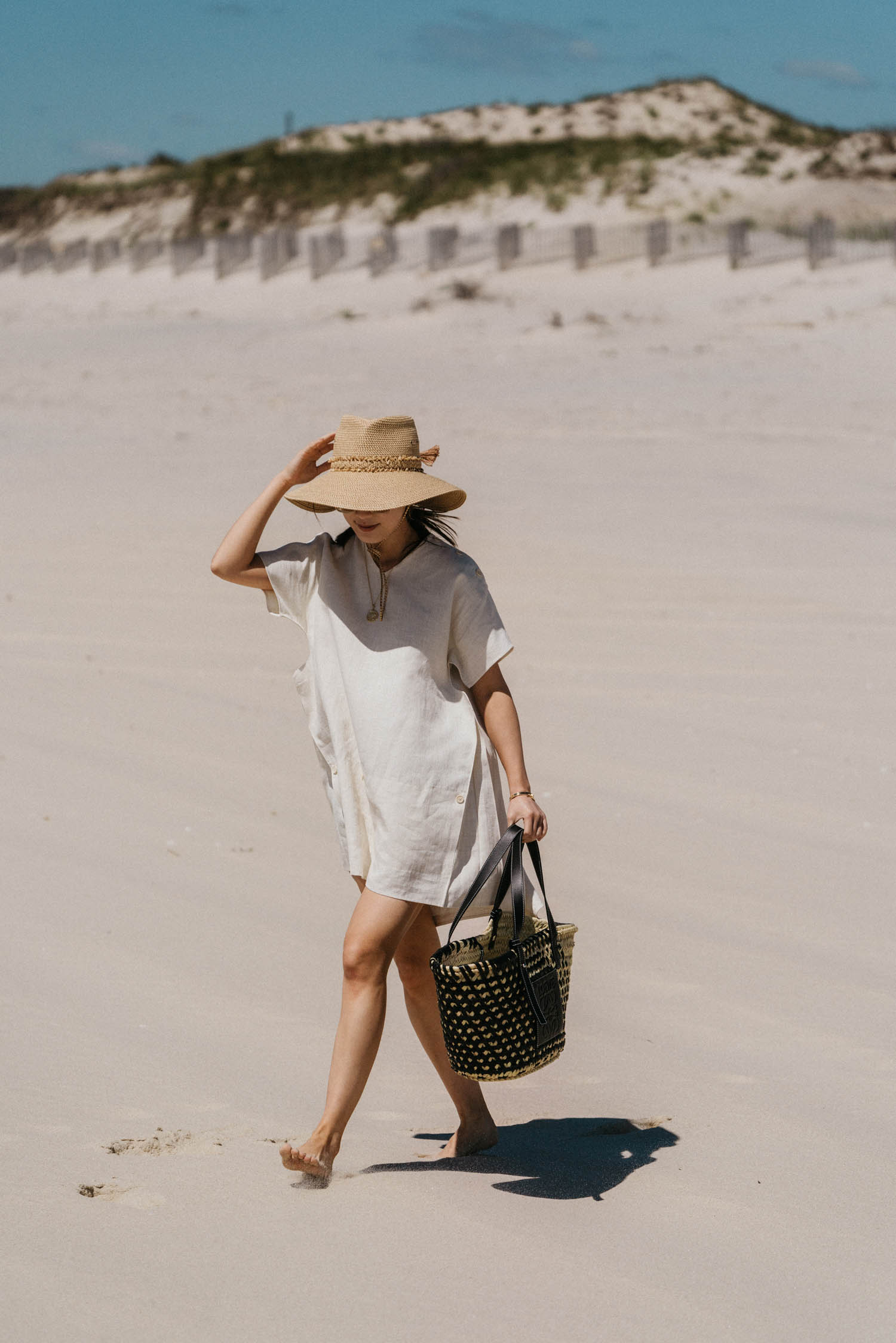 Jil Sander Dress, Loewe Bag, Eric Javits Hat, Celine Sunglasses, Azlee Necklace