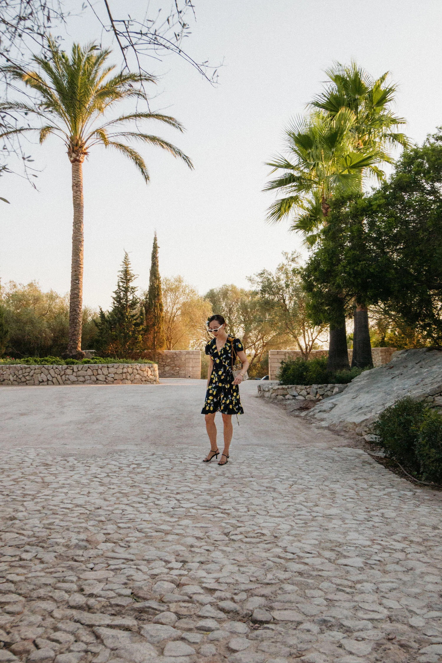 Wearing Barneys New York Dress , The Row Sandals , Montunas Bag , Celine Sunglasses