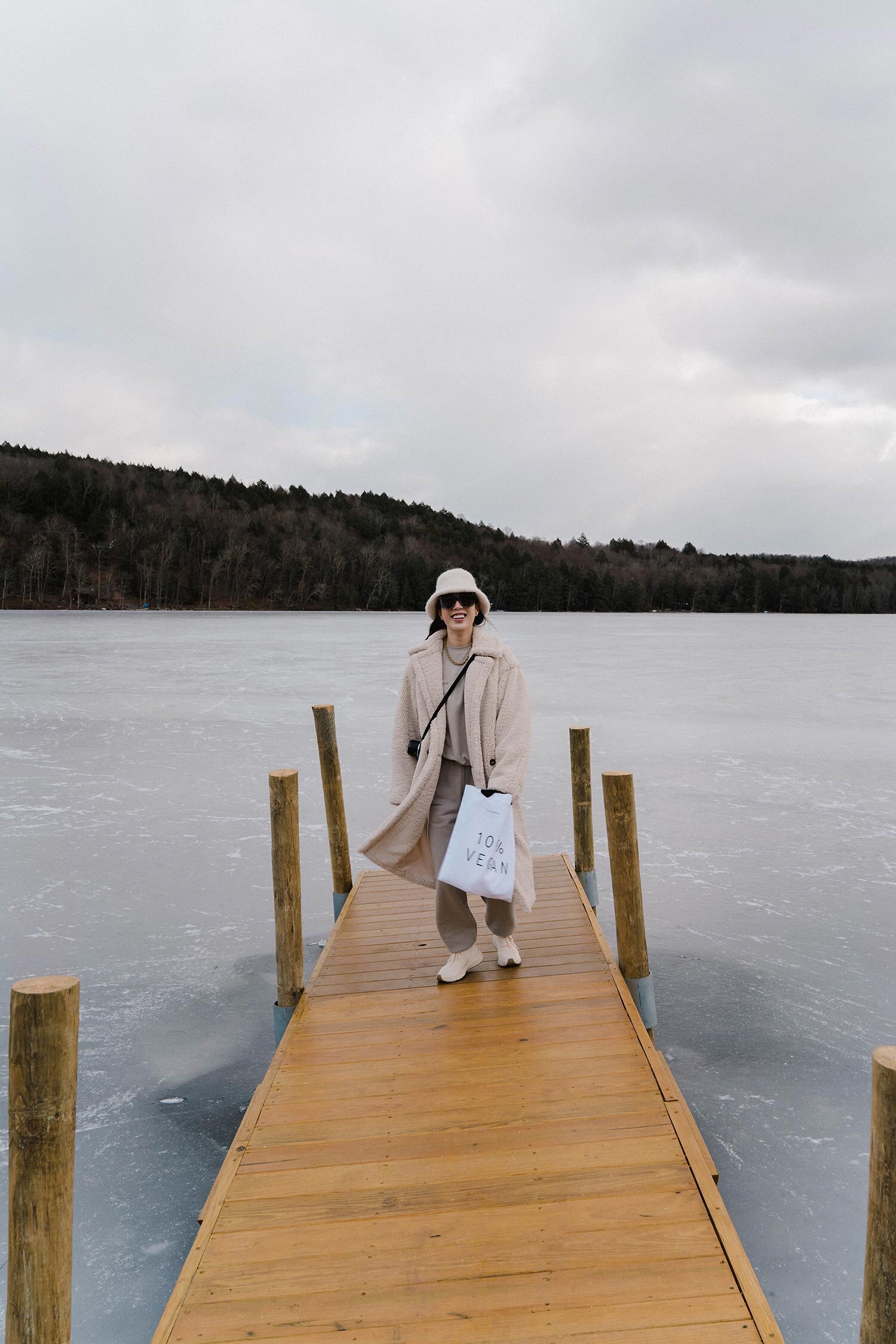 Apparis Coat, Pangaia Sweatshirt and Sweatpants, Veja x Rick Owens Sneakers, Superegg Tote, Lauren Manoogian Hat