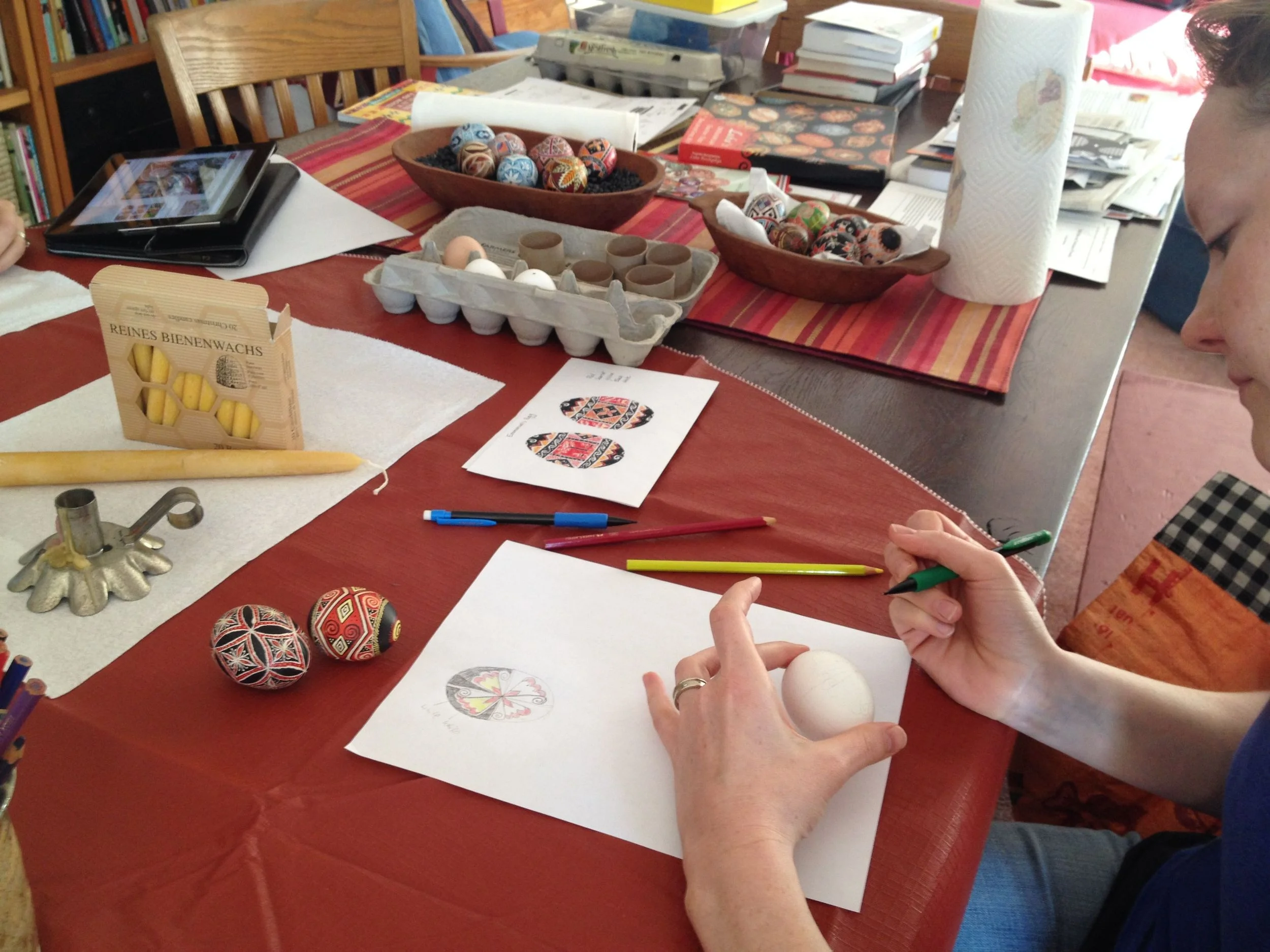 Sketching designs onto the eggs