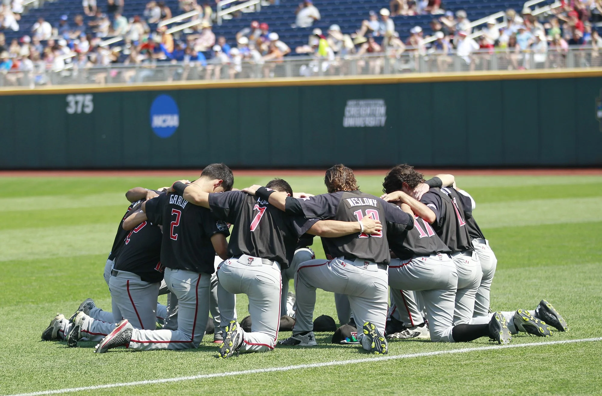  Tech players gather in the outfield before the game against Florida in the 2016 NCAA World Series on June 21, 2016, at the T.D. Ameritrade Park in Omaha, NE. 