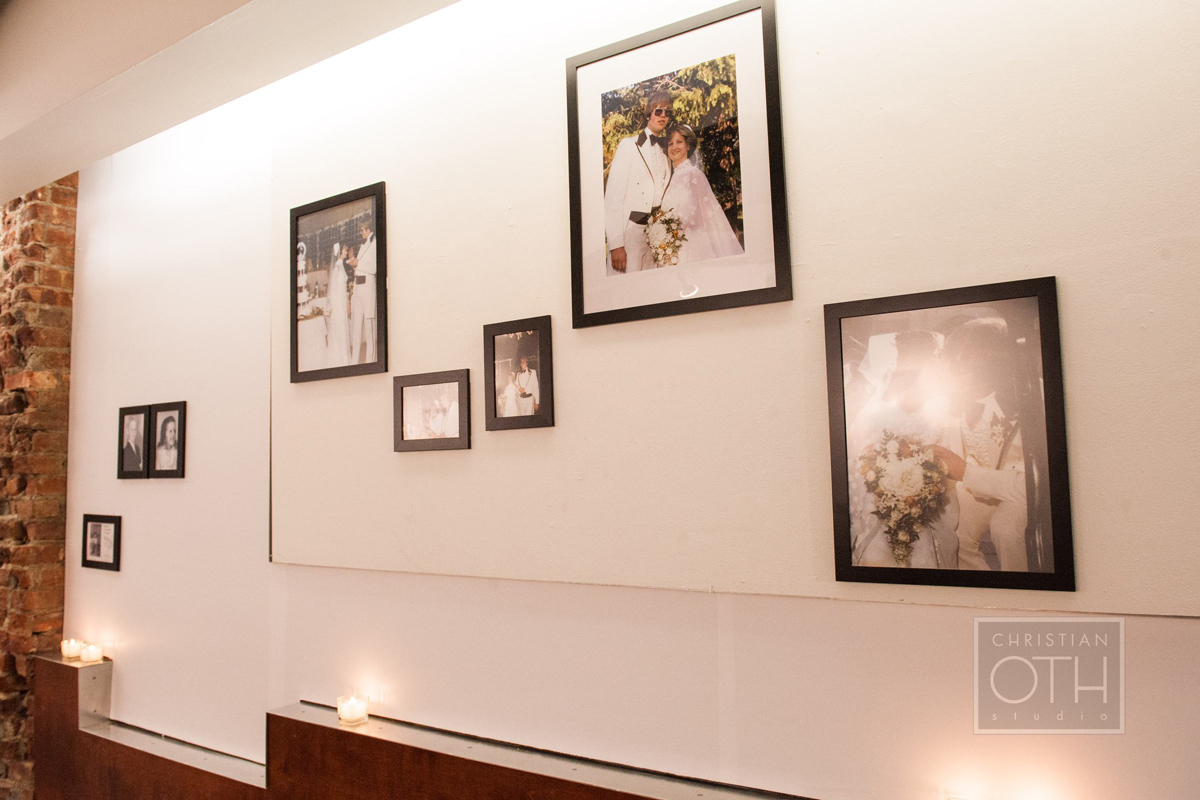   Photos of family members scanned, printed, and framed, are arranged in a gallery style along corridor to reception hall.   Photo: Sue Kessler of  Christian Oth Studio  