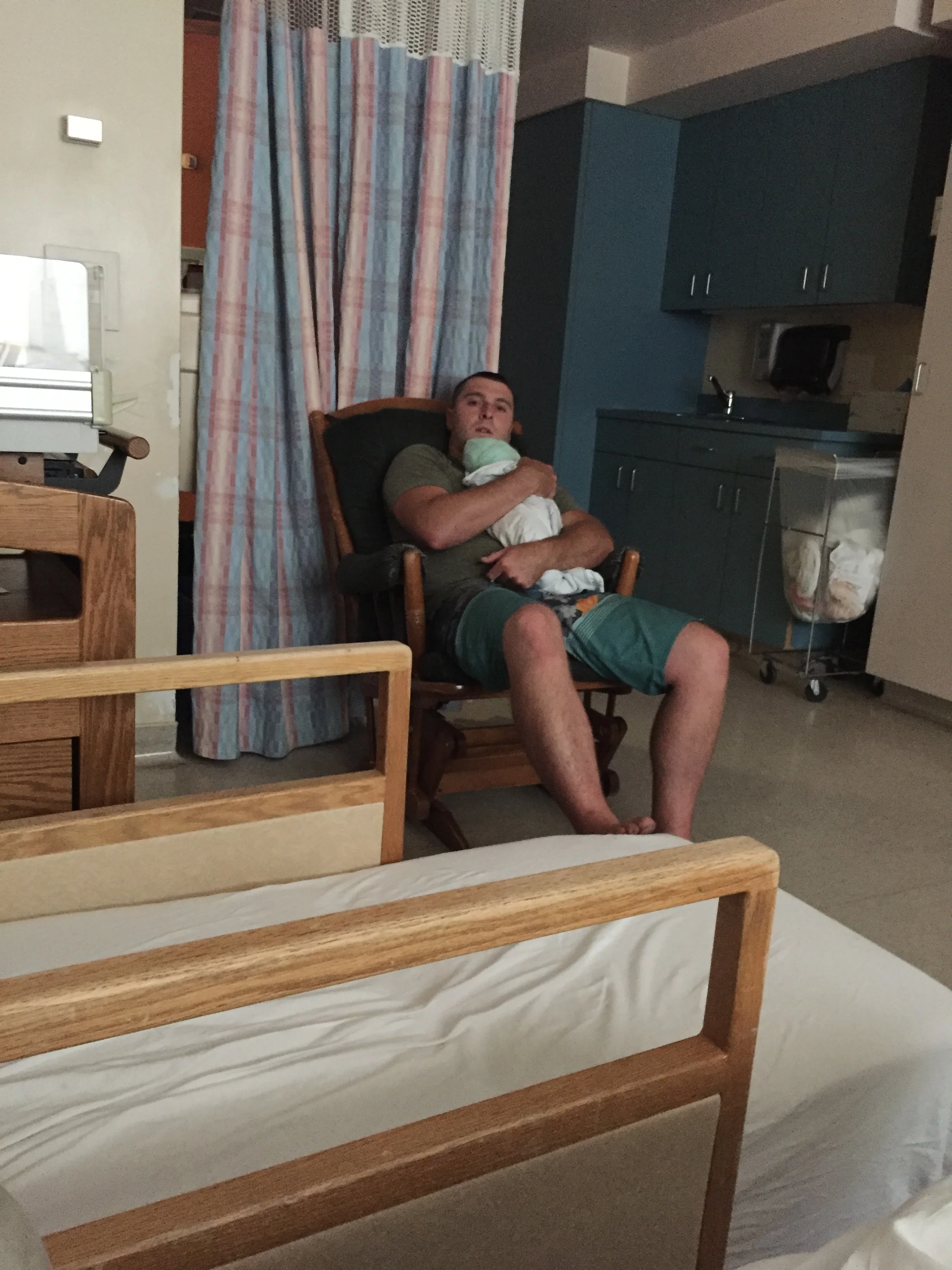  Very tired dad. He had an extra long weekend of working night shoots, plus supporting mom through a very long labour, and then trying to sleep on a hospital cot, with a new baby! 