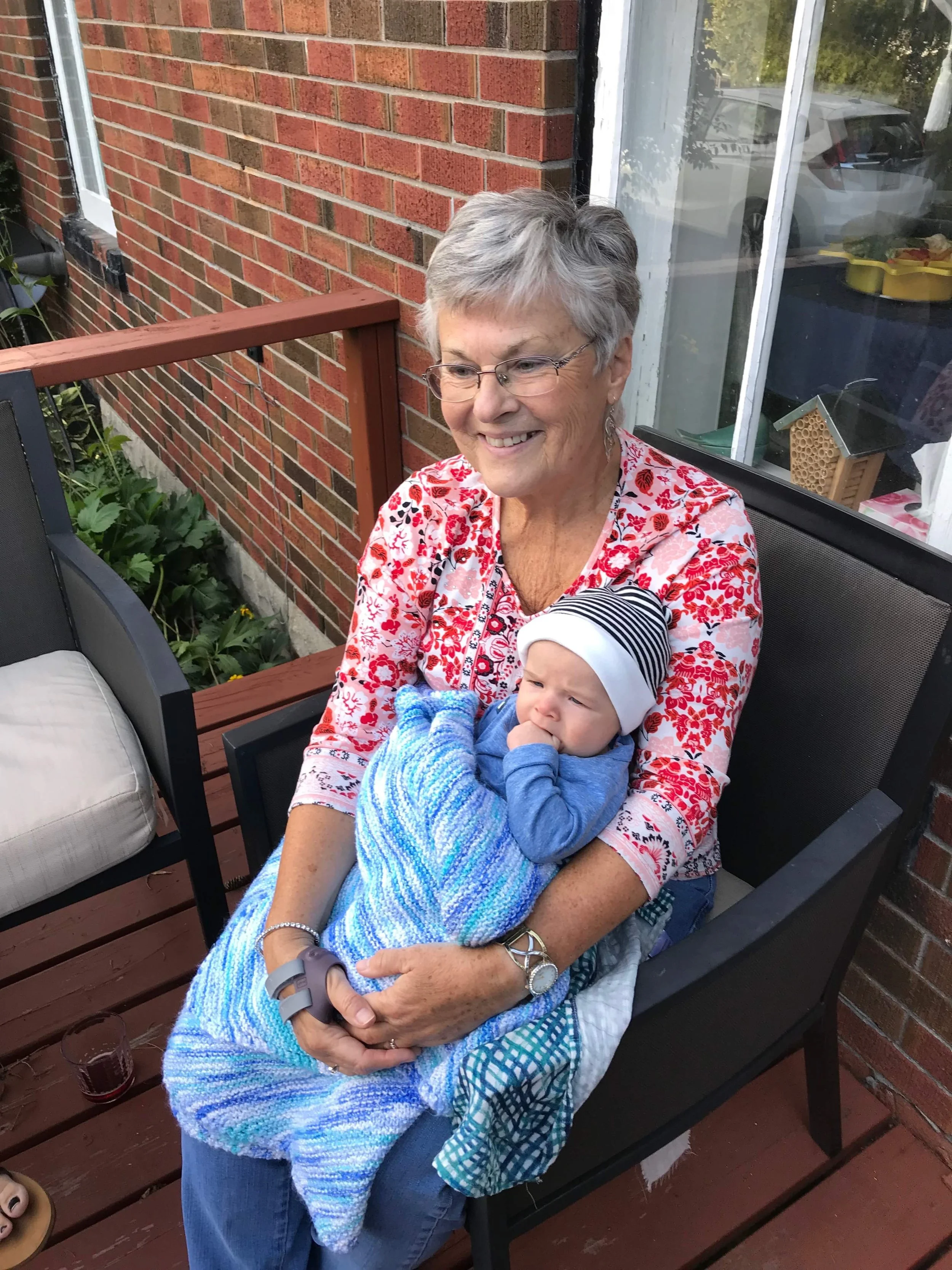 Staying warm on the porch with Nana 