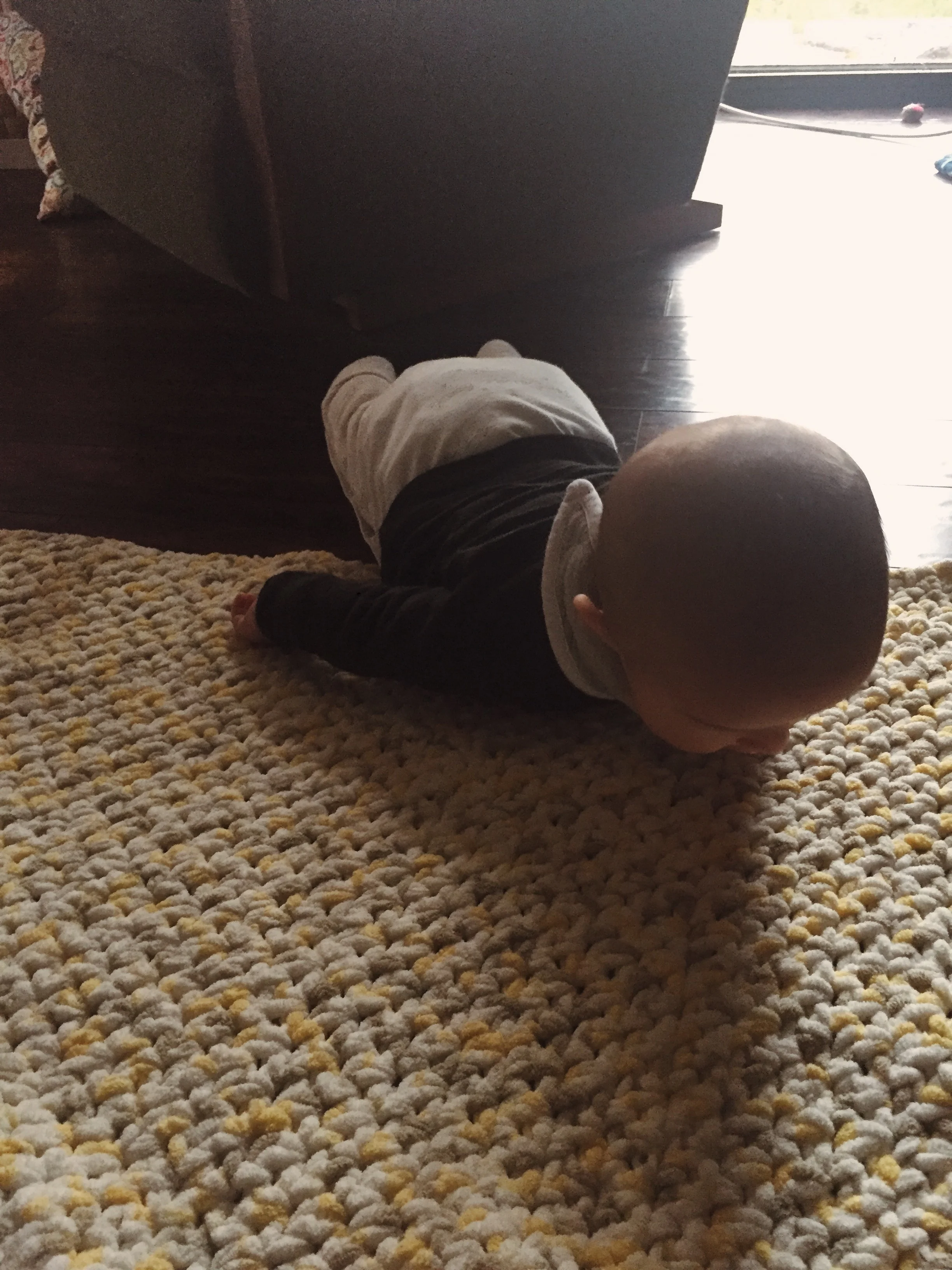  I set Enoch down on his back and looked away for a moment. When I looked back, he was like this! First roll over!  